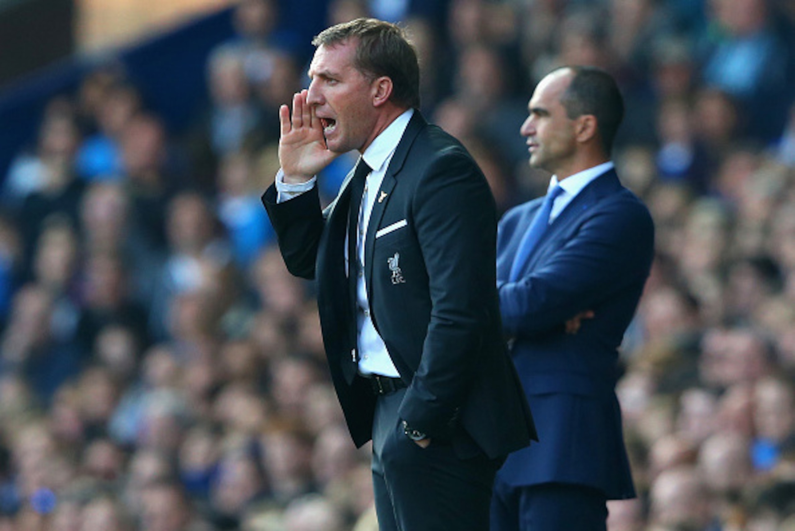 LIVERPOOL, ENGLAND - OCTOBER 04:  Brendan Rodgers manager of Liverpool reacts as Roberto Martinez manager of Everton looks on during the Barclays Premier League match between Everton and Liverpool at Goodison Park on October 4, 2015 in Liverpool, England.