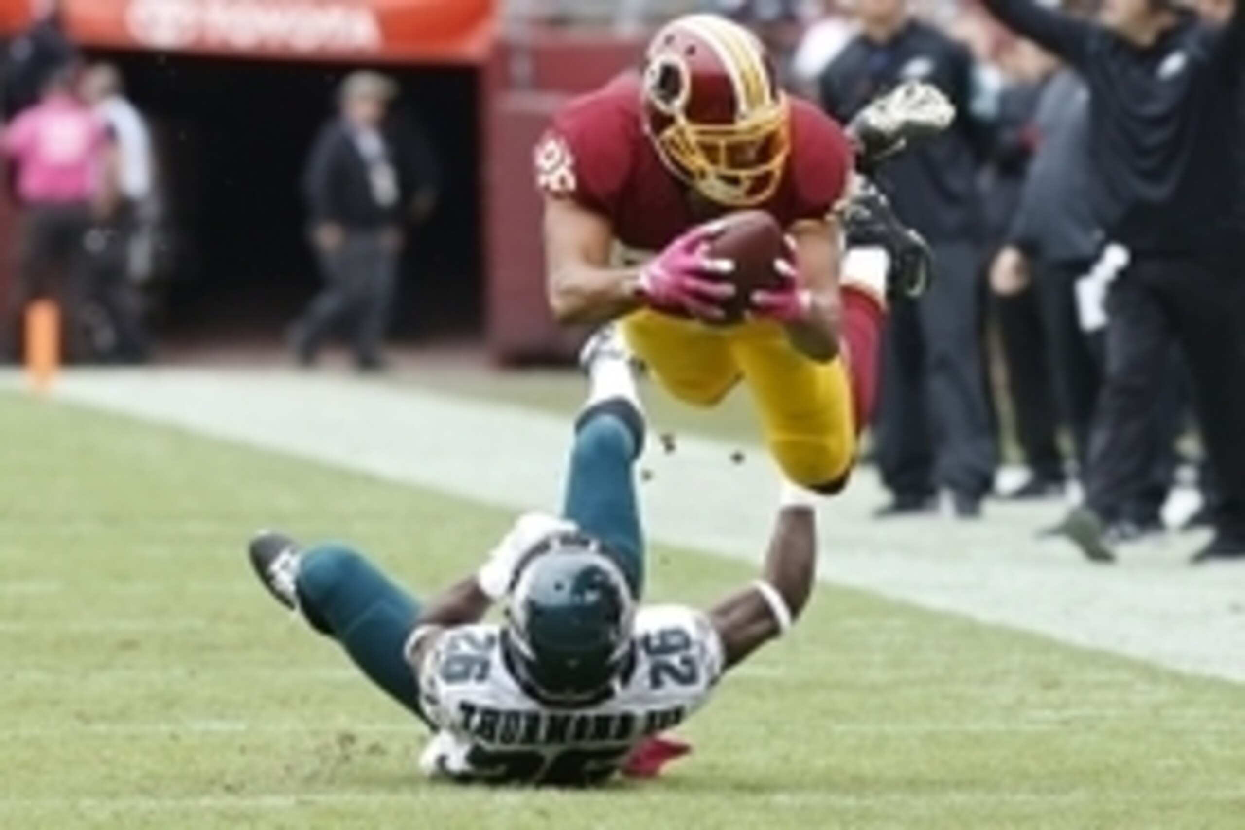 Oct 4, 2015; Landover, MD, USA; Washington Redskins tight end Jordan Reed (86) dives with the ball over Philadelphia Eagles strong safety Walter Thurmond (26) for a first down in the first quarter at FedEx Field. Mandatory Credit: Geoff Burke-USA TODAY Sp