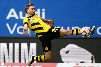 HAMBURG, GERMANY - MARCH 07:  Marcel Schmelzer of Dortmund controls the ball during the First Bundesliga match between Hamburger SV and Borussia Dortmund at Imtech Arena on March 7, 2015 in Hamburg, Germany.  (Photo by Boris Streubel/Getty Images)