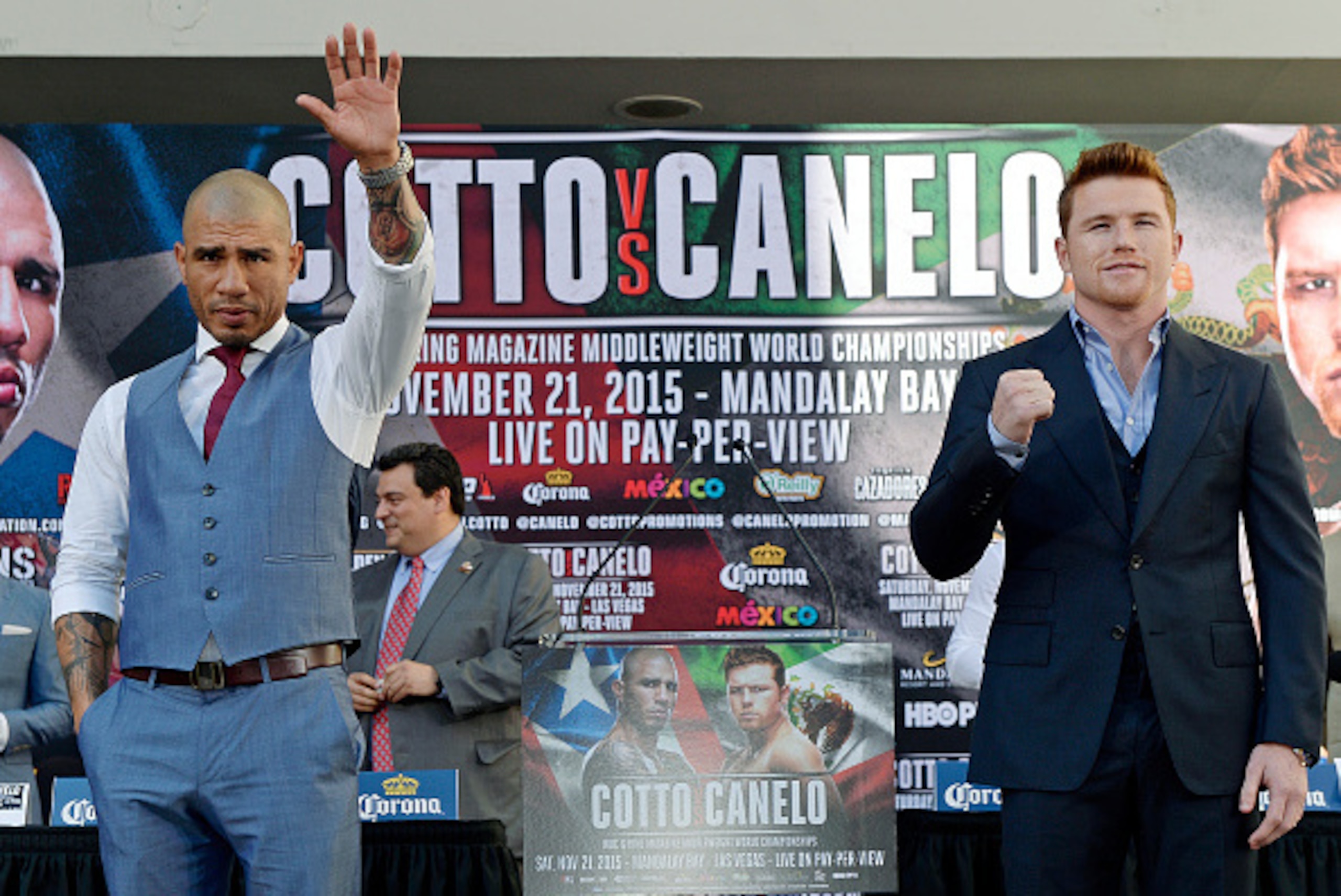 LOS ANGELES, CA - AUGUST 24: Current WBC champion Miguel Cotto (L) and contender Canelo Alvarez, Former WBC and WBA Super Welterweight World Champion, pose after a news conference announcing their upcoming WBC middleweight title bout on August 24, 2015, i