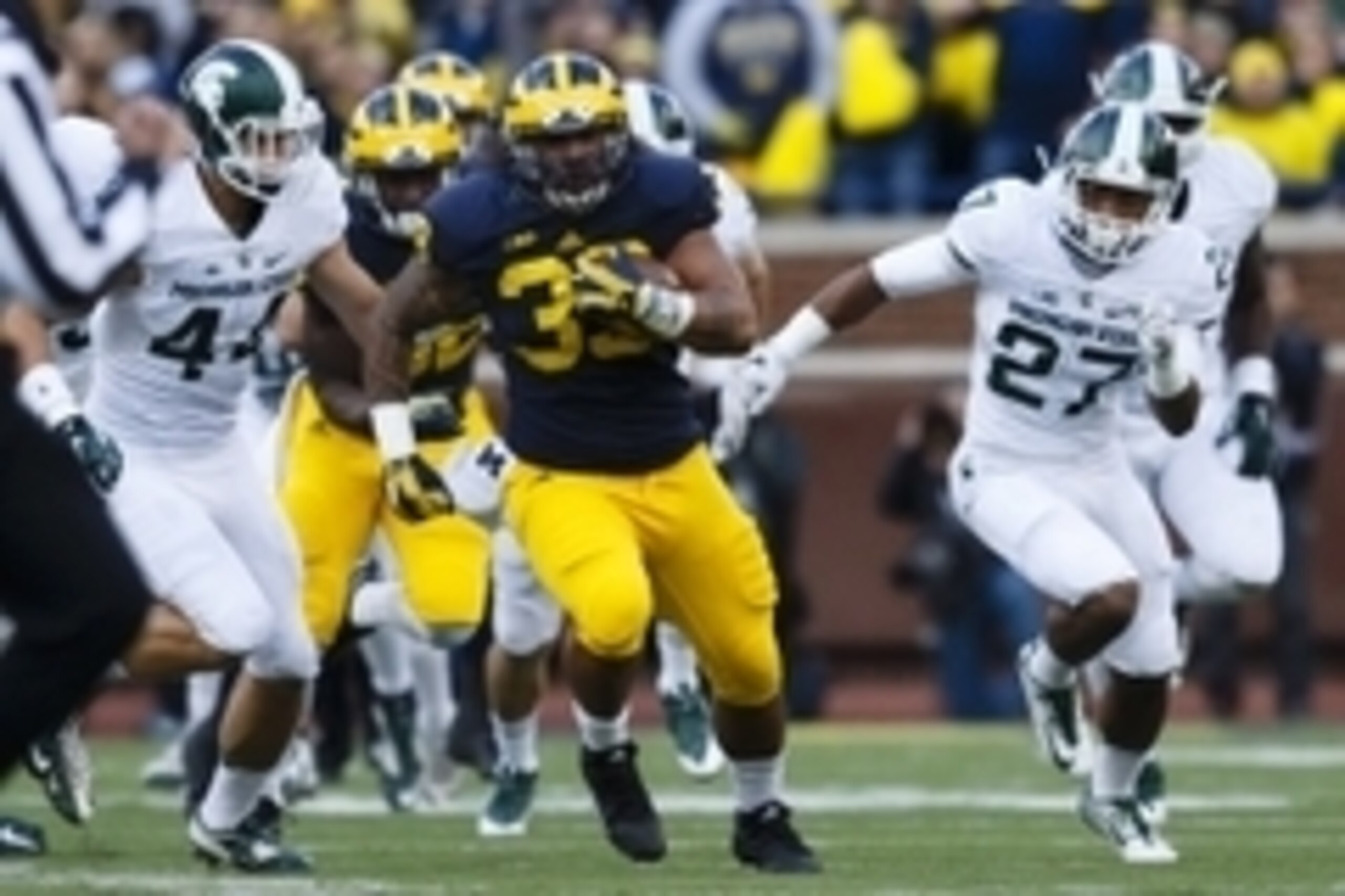 Oct 17, 2015; Ann Arbor, MI, USA; Michigan Wolverines fullback Sione Houma (39) rushes in the first half against the Michigan State Spartans at Michigan Stadium. Mandatory Credit: Rick Osentoski-USA TODAY Sports