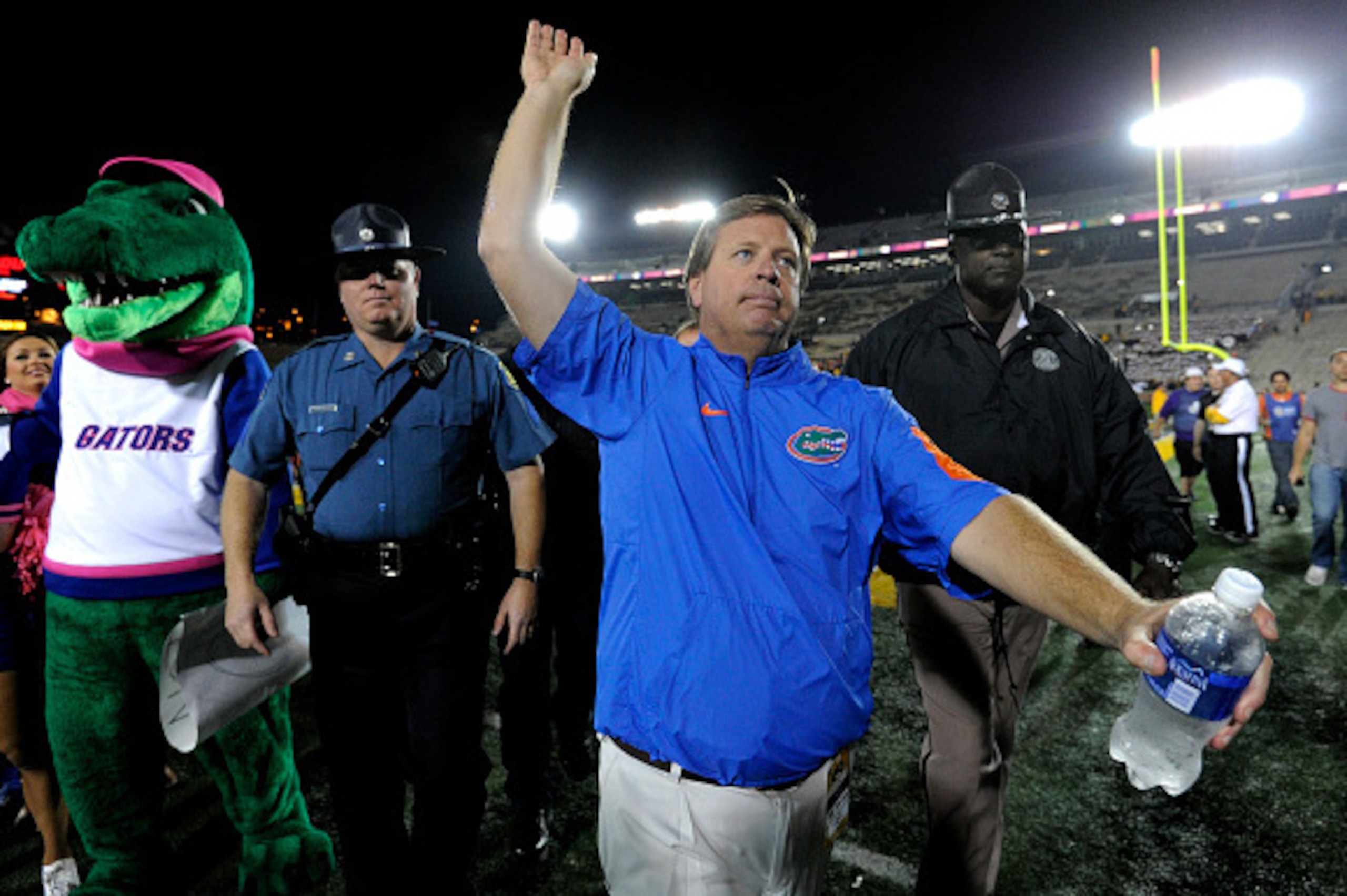 COLUMBIA , MO - OCTOBER 10:  Jim McElwain head coach of the Florida Gators wave to fans as he leaves the field after a 21-3 win over the Missouri Tigers at Memorial Stadium on October 10, 2015 in Columbia, Missouri.  (Photo by Ed Zurga/Getty Images)