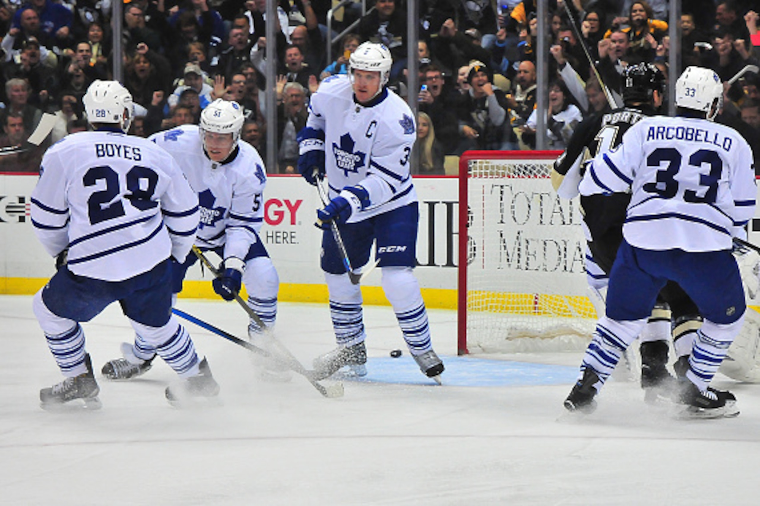 PITTSBURGH, PA - OCTOBER 17: Dion Phaneuf #3 of the Toronto Mapleleafs reaches for the puck against the Pittsburgh Penguins during the game at Consol Energy Center on October 17, 2015 in Pittsburgh, Pennsylvania. (Photo by Matt Kincaid/Getty Images)