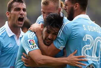 VILLARREAL, SPAIN - OCTOBER 18:  Nolito of Celta celebrates scoring his team's second goal with his teammates Sergi Gomez, John Guidetti and Jonathan Castro (L) during the La Liga match between Villarreal CF and RC Celta de Vigo at El Madrigal Stadium on 