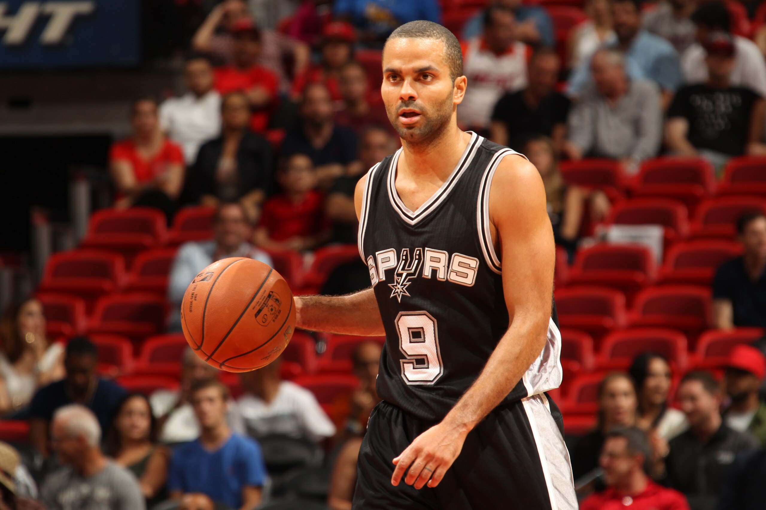 MIAMI, FL - OCTOBER 12: Tony Parker #9 of the San Antonio Spurs drives to the basket against the Miami Heat during a preseason game on October 12, 2015 at AmericanAirlines Arena in Miami, Florida. NOTE TO USER:  User expressly acknowledges and agrees that