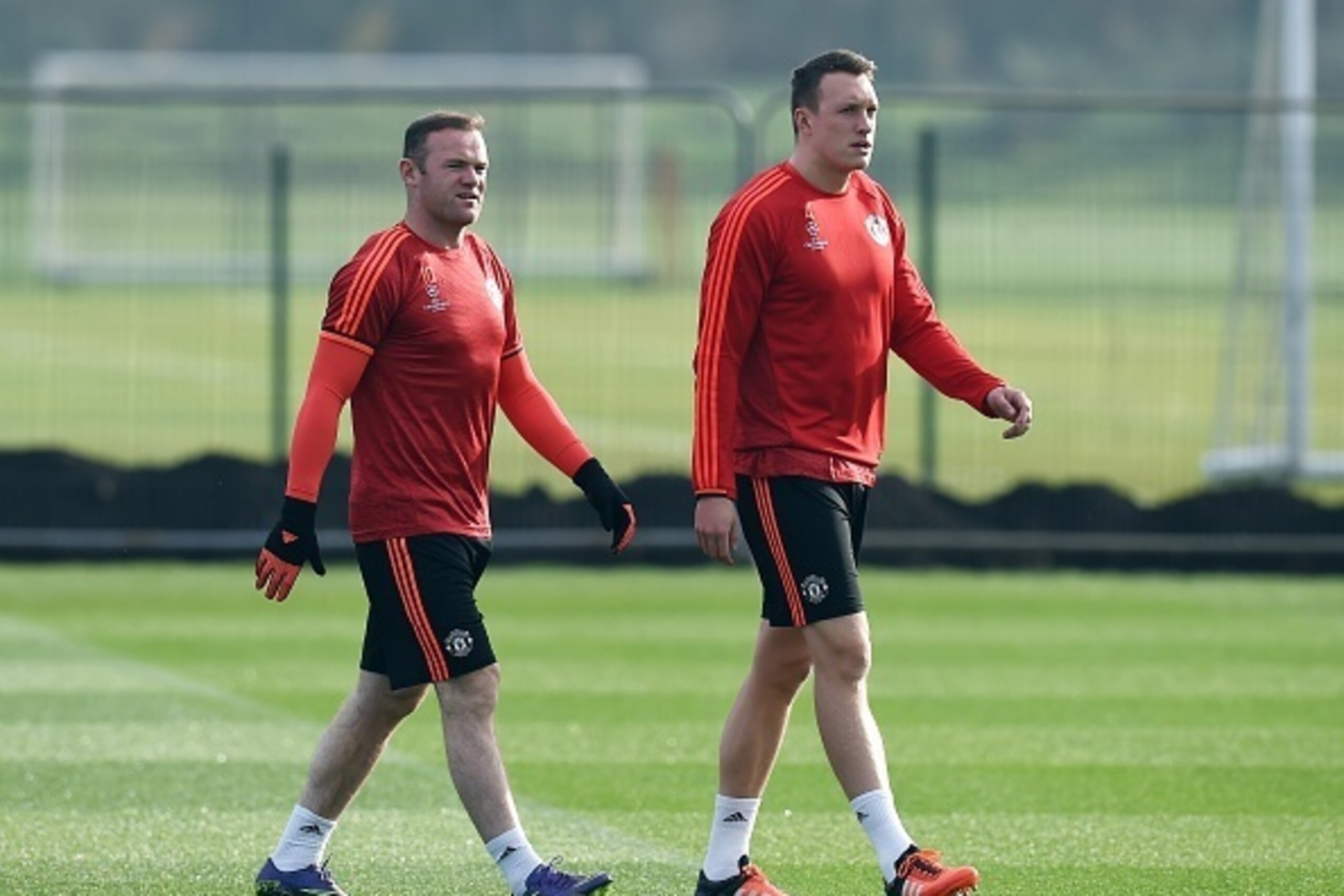 Manchester United's English striker Wayne Rooney (L) and Manchester United's English defender Phil Jones (R) arrive for a training session at their Carrington facility in Manchester, north west England on October 20, 2015 ahead of their Champions League f