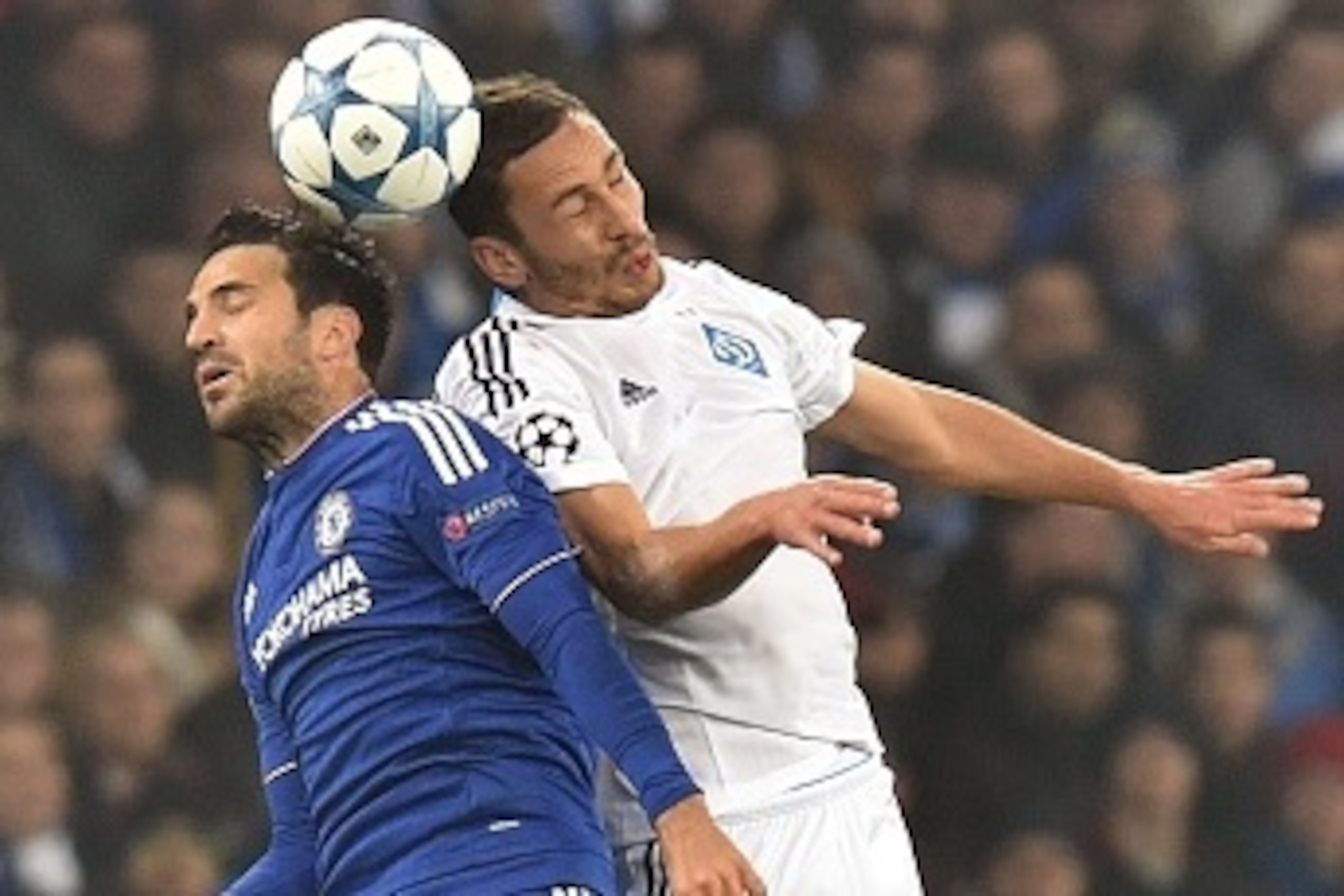 Chelsea's Spanish midfielder Cesc Fabregas (L) vies with Dynamo Kiev's Ukrainian midfielder Serhiy Rybalka  during the UEFA Champions League football match Dynamo Kiev vs Chelsea, on October 20, 2015 at the Olympic stadium in Kiev. AFP PHOTO / GENYA SAVIL