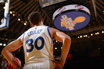 OAKLAND, CA - OCTOBER 15:  Stephen Curry #30 of the Golden State Warriors looks on during the game against the Houston Rockets on October 15, 2015 at Oracle Arena in Oakland, California. NOTE TO USER: User expressly acknowledges and agrees that, by downlo
