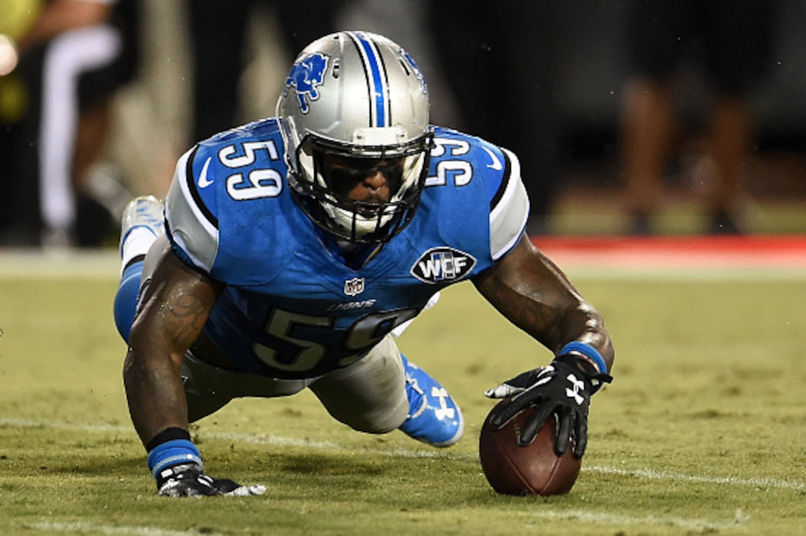 JACKSONVILLE, FL - AUGUST 28:  Tahir Whitehead #59 of the Detroit Lions falls on a loose ball during the third quarter of a preseason game against the Jacksonville Jaguars at EverBank Field on August 28, 2015 in Jacksonville, Florida.  (Photo by Stacy Rev