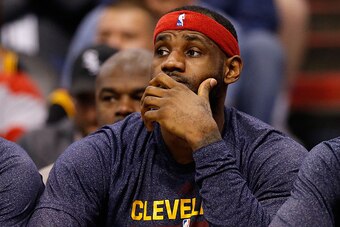 PHOENIX, AZ - JANUARY 13:  LeBron James #23 of the Cleveland Cavaliers reacts on the bench during the NBA game against the Phoenix Suns at US Airways Center on January 13, 2015 in Phoenix, Arizona.  NOTE TO USER: User expressly acknowledges and agrees tha