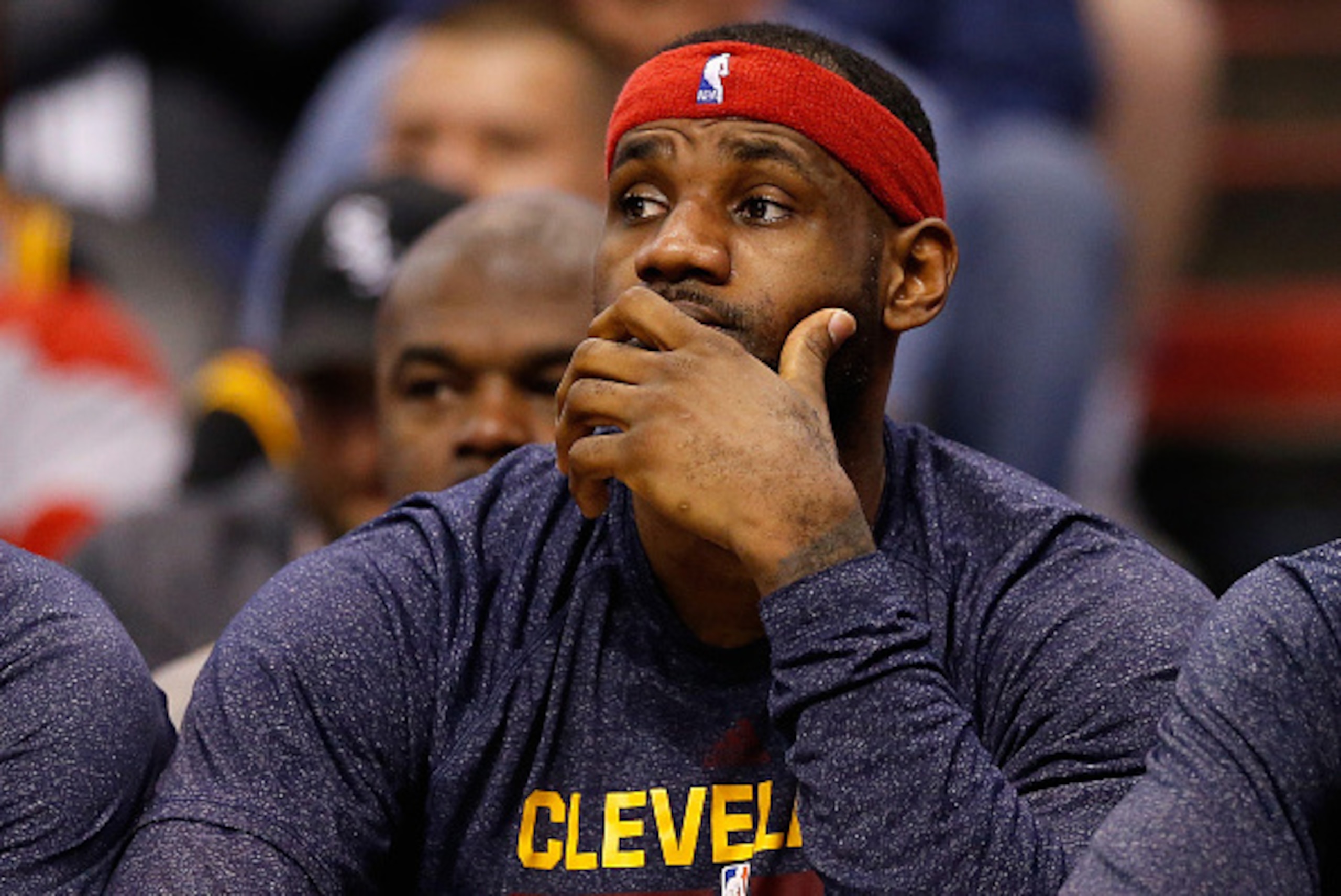 PHOENIX, AZ - JANUARY 13:  LeBron James #23 of the Cleveland Cavaliers reacts on the bench during the NBA game against the Phoenix Suns at US Airways Center on January 13, 2015 in Phoenix, Arizona.  NOTE TO USER: User expressly acknowledges and agrees tha