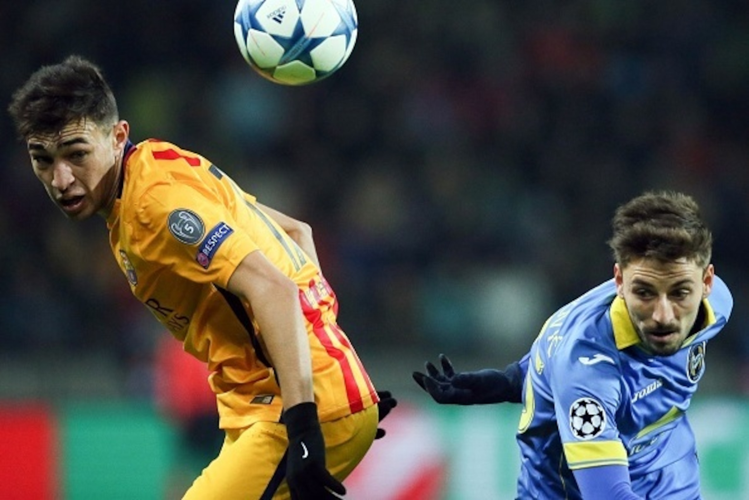 Barcelona's forward Munir El Haddadi (L) vies for the ball with BATE Borisov's Serbian defender Filip Mladenovic during the UEFA Champions League group E football match between FC BATE Borisov and FC Barcelona at the Borisov Arena stadium outside Minsk on