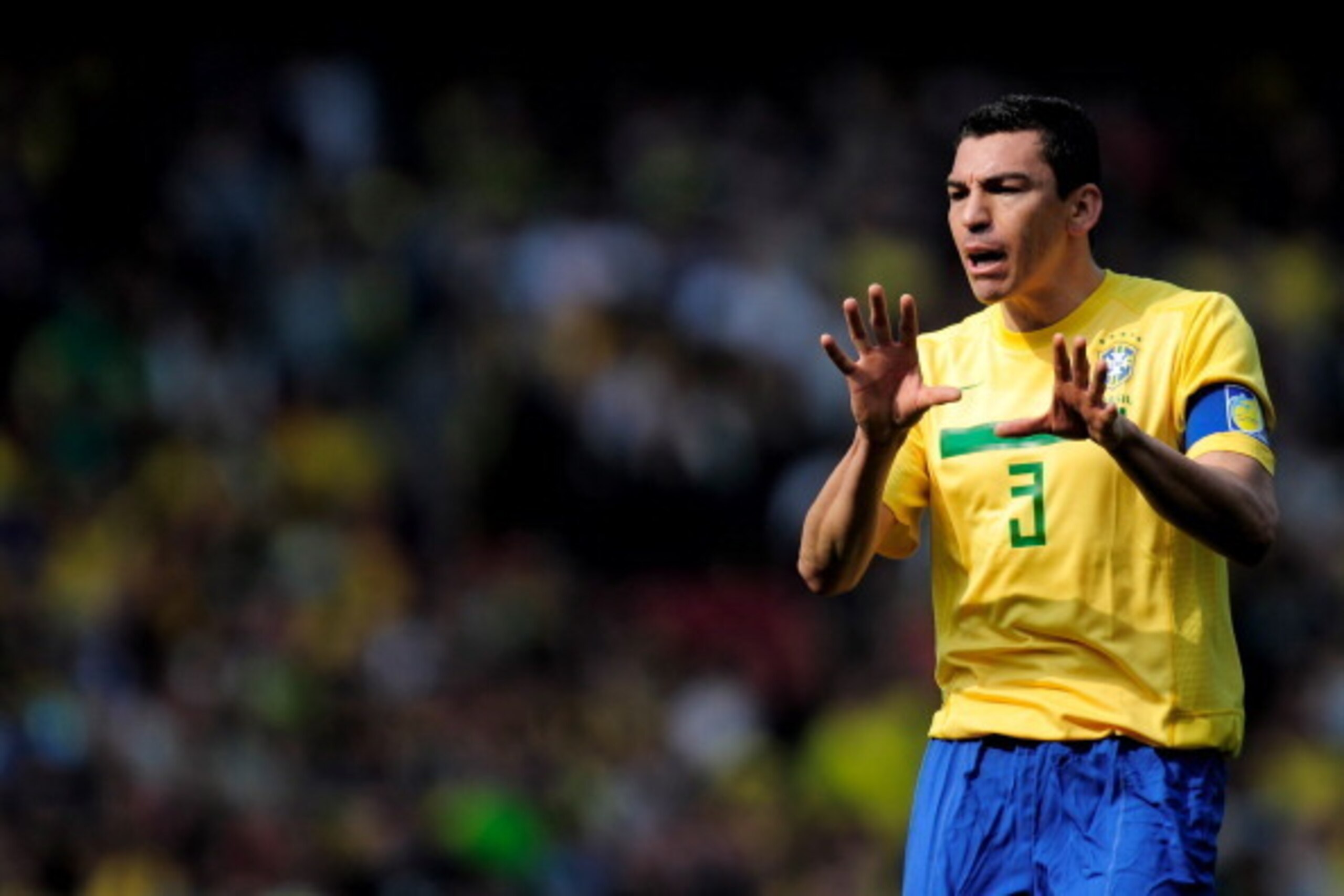LONDON, ENGLAND - MARCH 27: Captain Lucio of Brazil gestures during the International friendly match between Brazil and Scotland at Emirates Stadium on March 27, 2011 in London, England.  (Photo by Jamie McDonald/Getty Images)