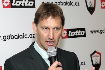Former Arsenal defender and Portsmouth manager Tony Adams gestures during a news conference in Baku on May 12, 2010. Adams signed a three-year deal today to coach an obscure football club in the ex-Soviet republic of Azerbaijan. At a press conference in t