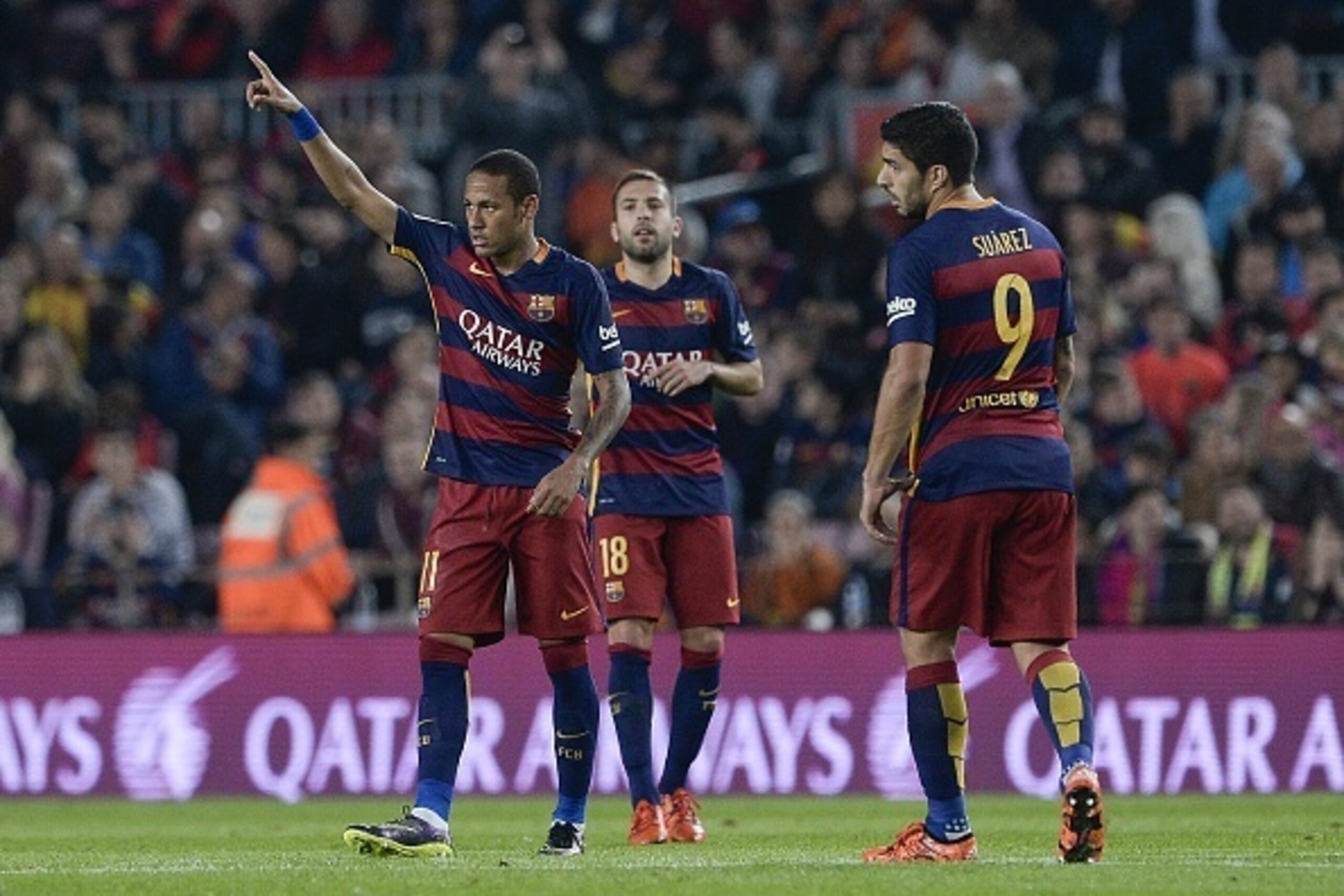 Barcelona's Brazilian forward Neymar da Silva Santos Junior (L) celebrates his goal next to teammates Barcelona's defender Jordi Alba (C) and Barcelona's Uruguayan forward Luis Suarez during the Spanish league football match FC Barcelona vs Rayo Vallecano
