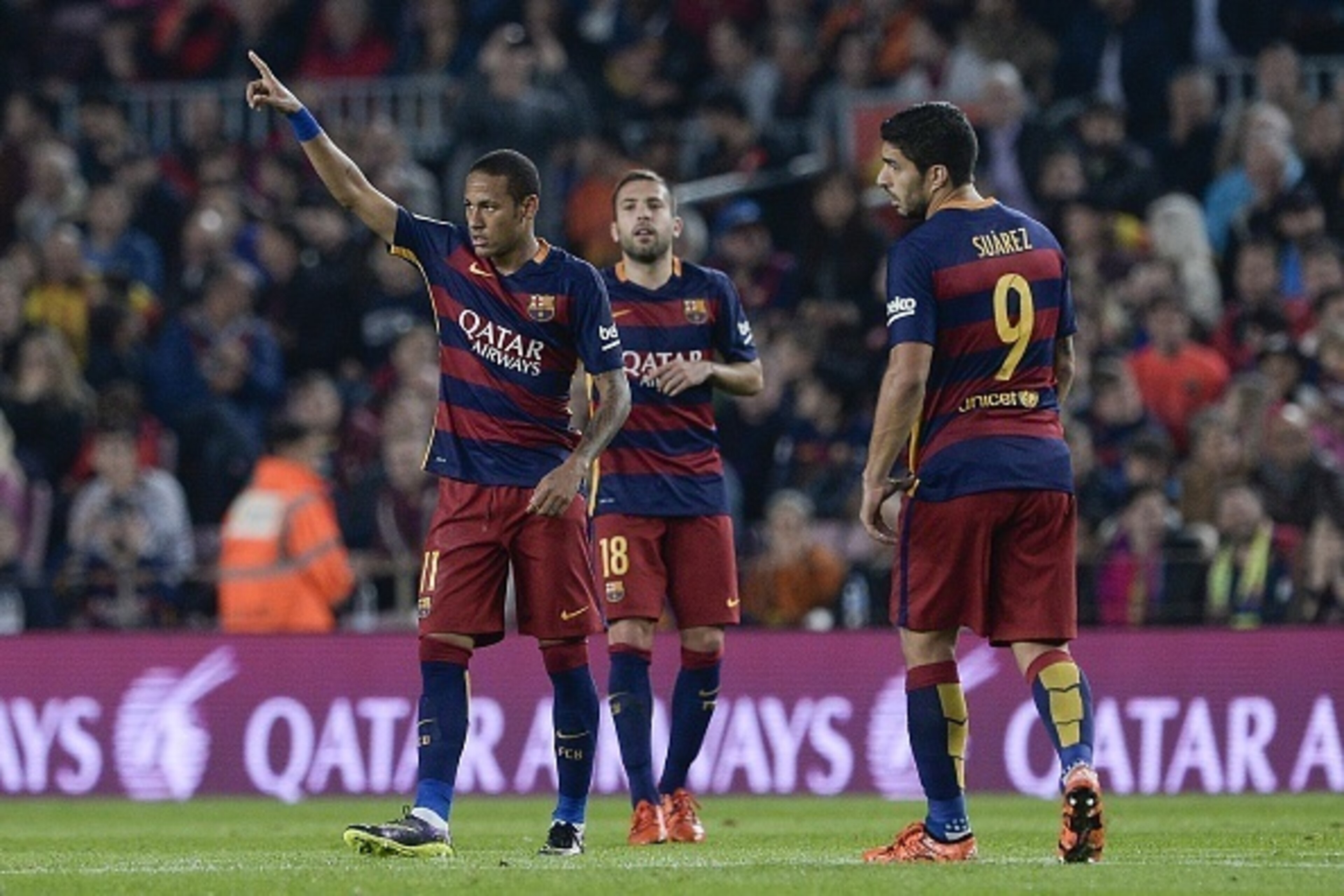Barcelona's Brazilian forward Neymar da Silva Santos Junior (L) celebrates his goal next to teammates Barcelona's defender Jordi Alba (C) and Barcelona's Uruguayan forward Luis Suarez during the Spanish league football match FC Barcelona vs Rayo Vallecano