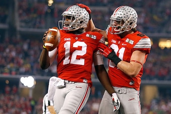 ARLINGTON, TX - JANUARY 12:  Quarterback Cardale Jones #12 of the Ohio State Buckeyes celebrates after scoring a one yard touchdown in the second quarter against the Oregon Ducks during the College Football Playoff National Championship Game at AT&T Stadi