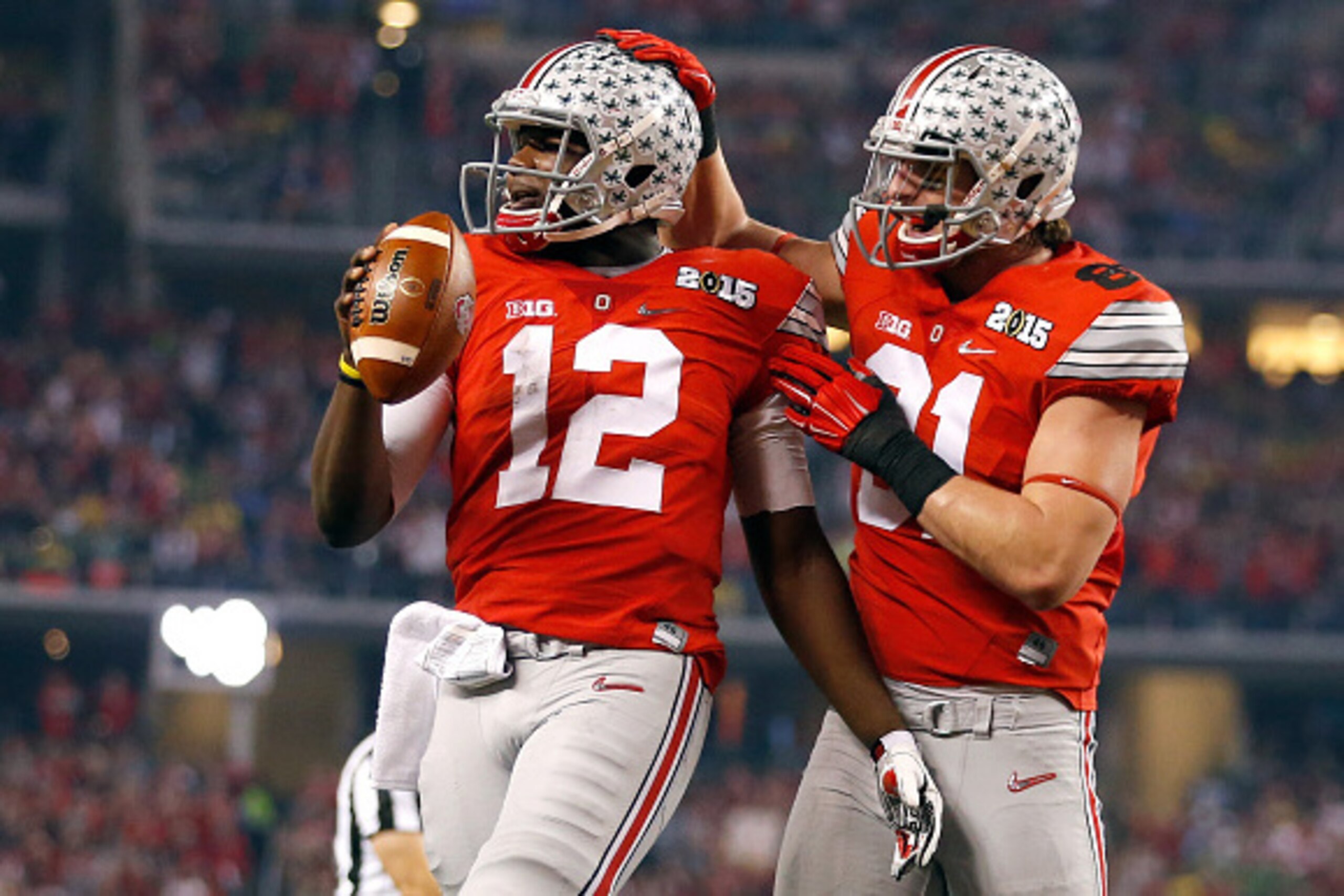 ARLINGTON, TX - JANUARY 12:  Quarterback Cardale Jones #12 of the Ohio State Buckeyes celebrates after scoring a one yard touchdown in the second quarter against the Oregon Ducks during the College Football Playoff National Championship Game at AT&T Stadi