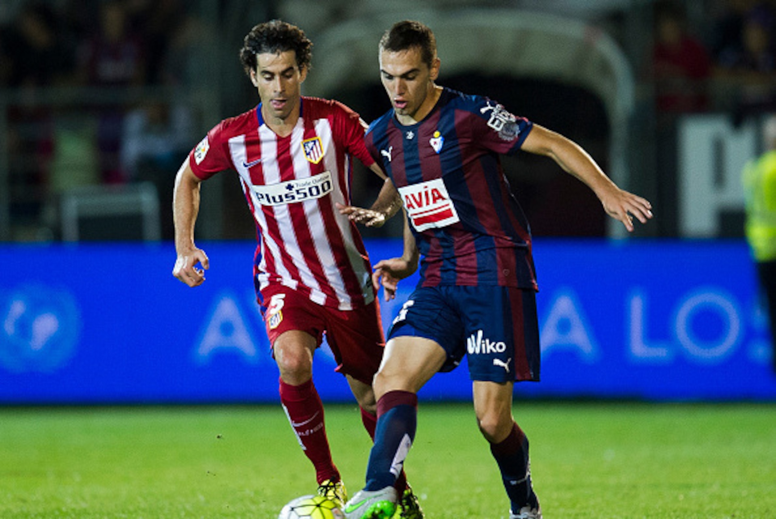 EIBAR, SPAIN - SEPTEMBER 19:  Tiago Mendes of Atletico de Madrid duels for the ball with Gonzalo Escalante of SD Eibar during the La Liga match between SD Eibar andÊAtletico de MadridÊat Ipurua Municipal Stadium on September 19, 2015 in Eibar, Spain.  (Ph
