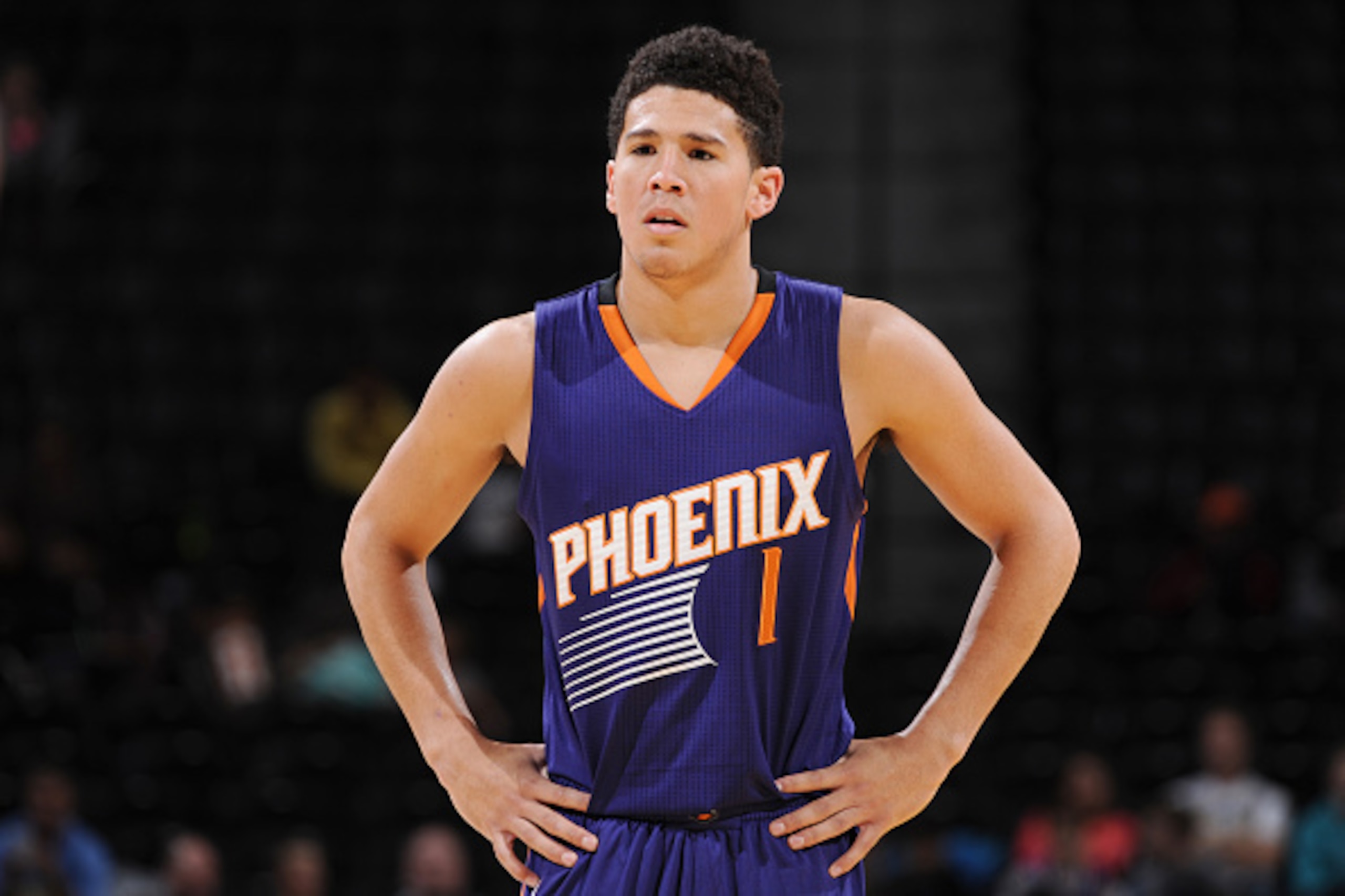 DENVER, CO - OCTOBER 16:  Devin Booker #1 of the Phoenix Suns stands on the court against the Denver Nuggets during a preseason game on October 16, 2015 at the Pepsi Center in Denver, Colorado. NOTE TO USER: User expressly acknowledges and agrees that, by