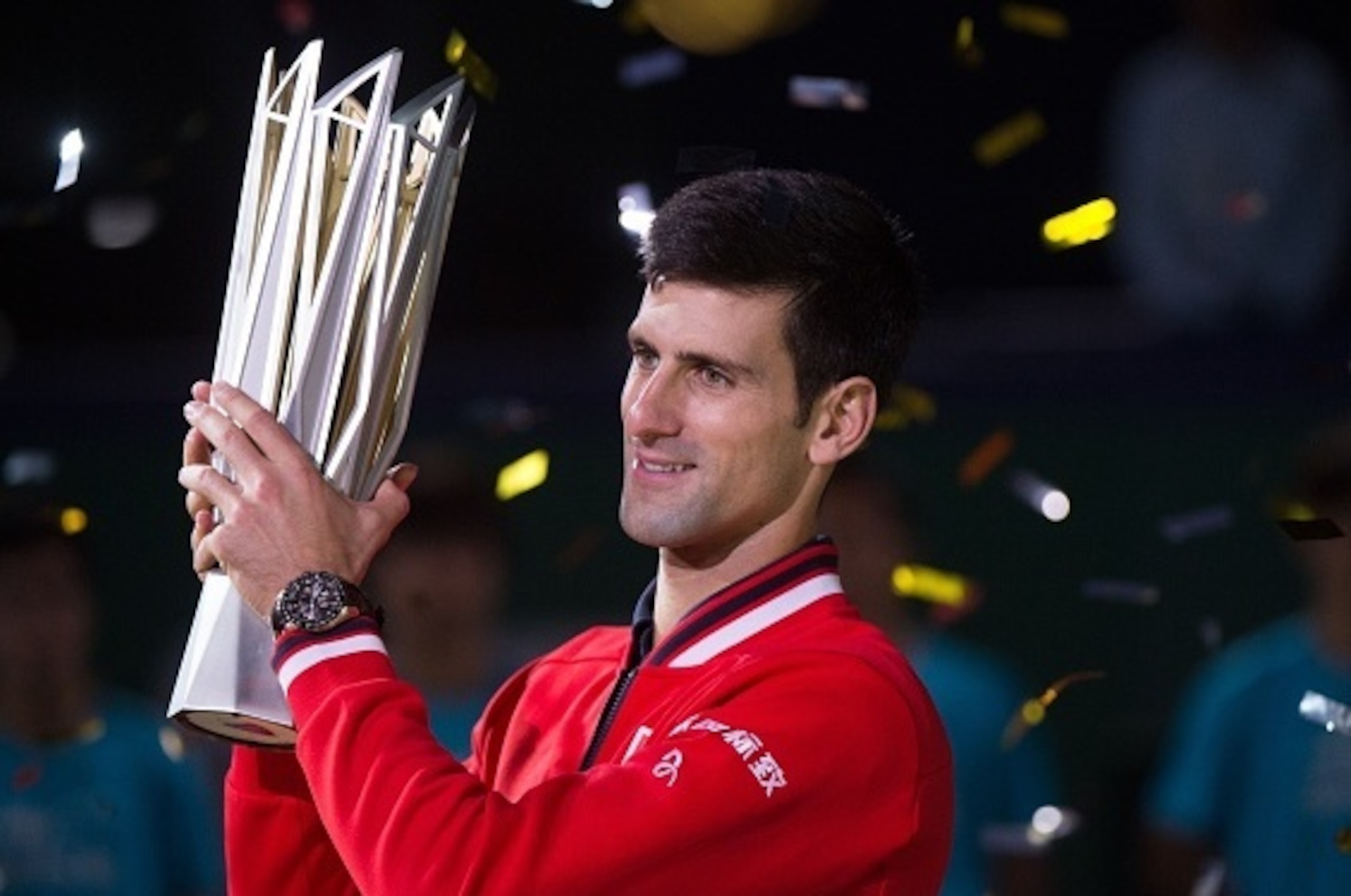 Novak Djokovic of Serbia holds his trophy after winning his men's singles final match against Jo-Wilfried Tsonga of France at the Shanghai Masters tennis tournament in Shanghai on October 18, 2015. AFP PHOTO / JOHANNES EISELE        (Photo credit should r