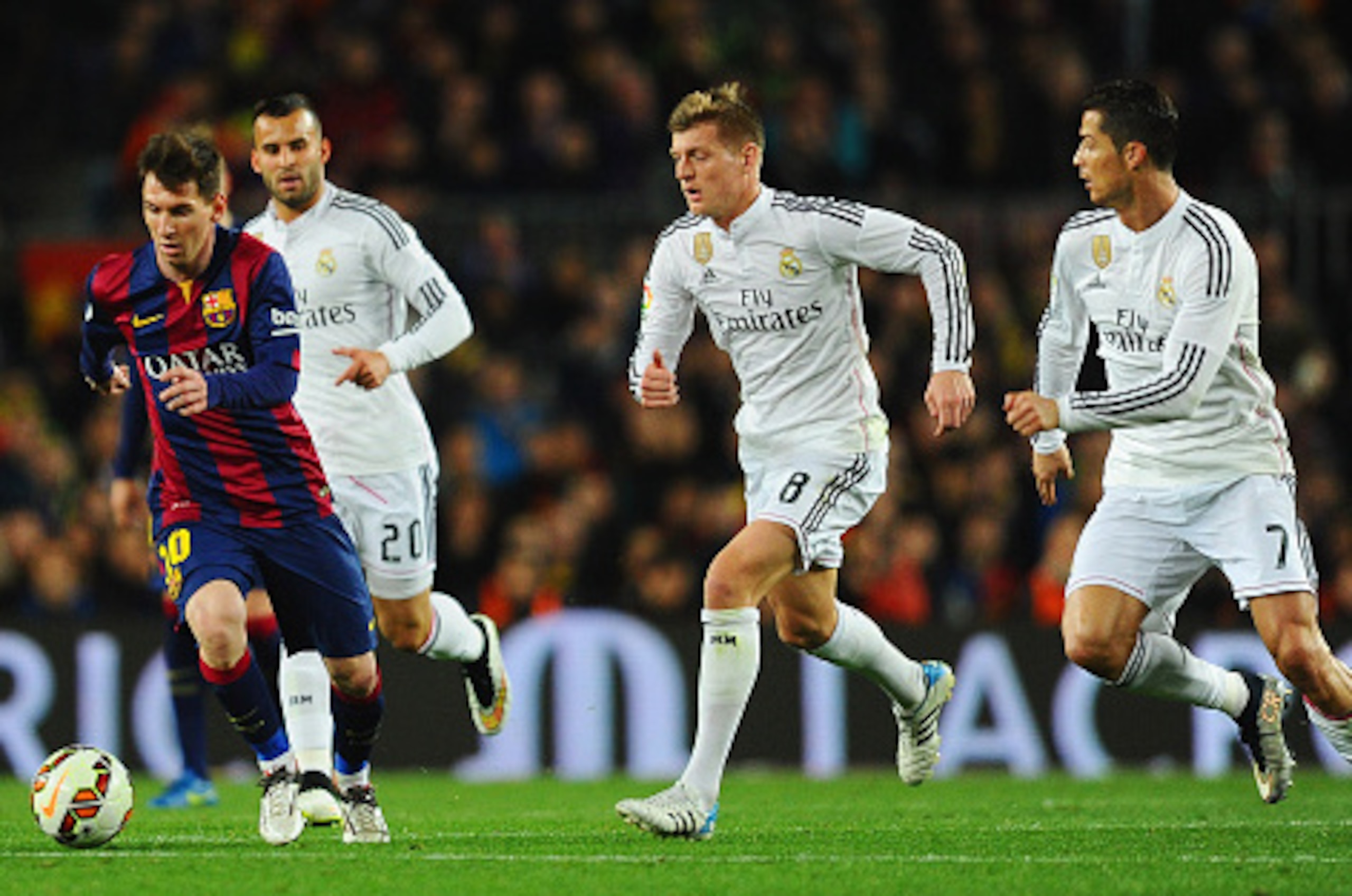 BARCELONA, SPAIN - MARCH 22:  Lionel Messi of Barcelona is chased by Jese (20), Toni Kroos (8) and Cristiano Ronaldo of Real Madrid CF (7) during the La Liga match between FC Barcelona and Real Madrid CF at Camp Nou on March 22, 2015 in Barcelona, Spain. 