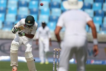 Shan Masood takes evasive action during the opening session on Day 1.