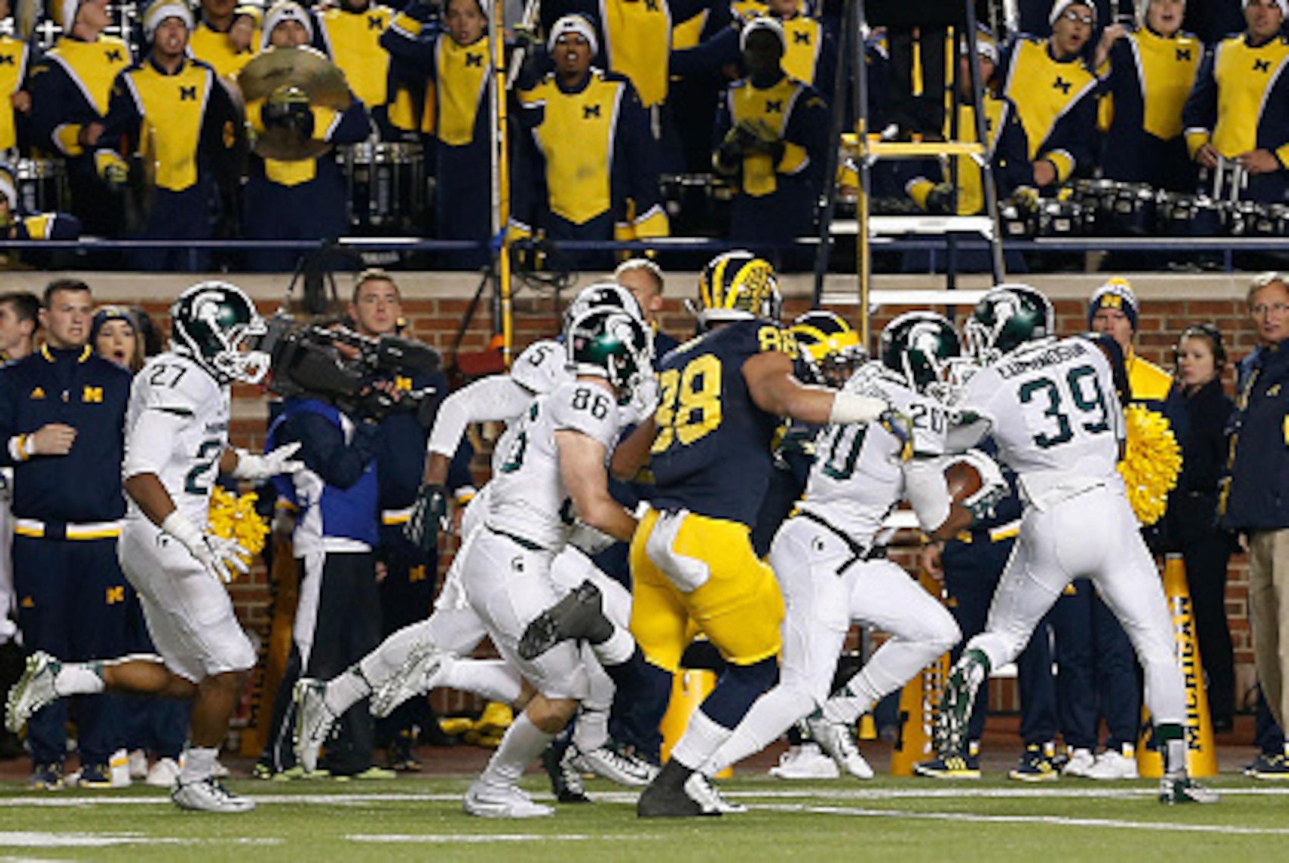 ANN ARBOR, MI - OCTOBER 17:  Defensive back Jalen Watts-Jackson #20 of the Michigan State Spartans runs the football into to endzone for the game winning touchdown against the Michigan Wolverines during the final seconds of college football game at Michig