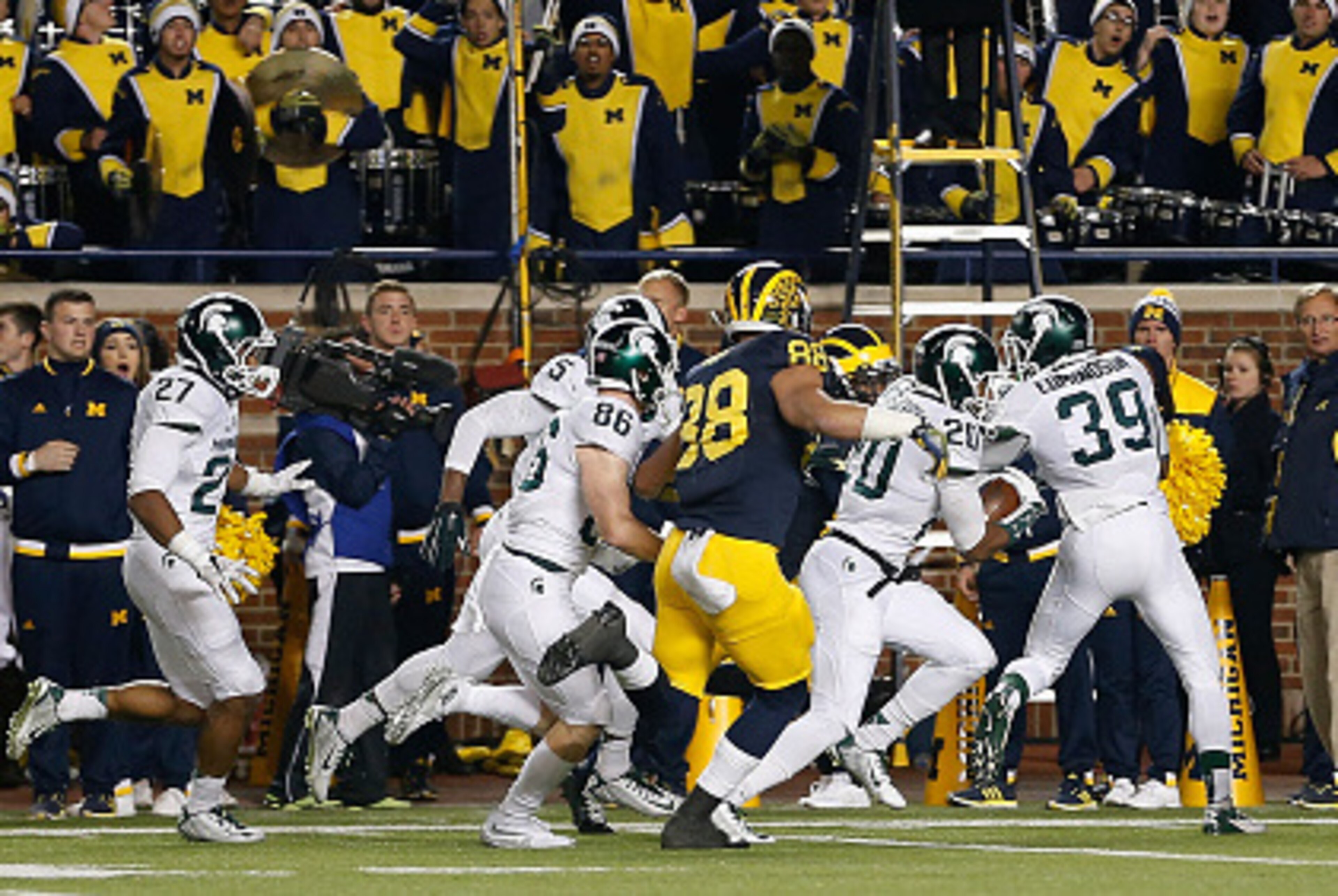 ANN ARBOR, MI - OCTOBER 17:  Defensive back Jalen Watts-Jackson #20 of the Michigan State Spartans runs the football into to endzone for the game winning touchdown against the Michigan Wolverines during the final seconds of college football game at Michig