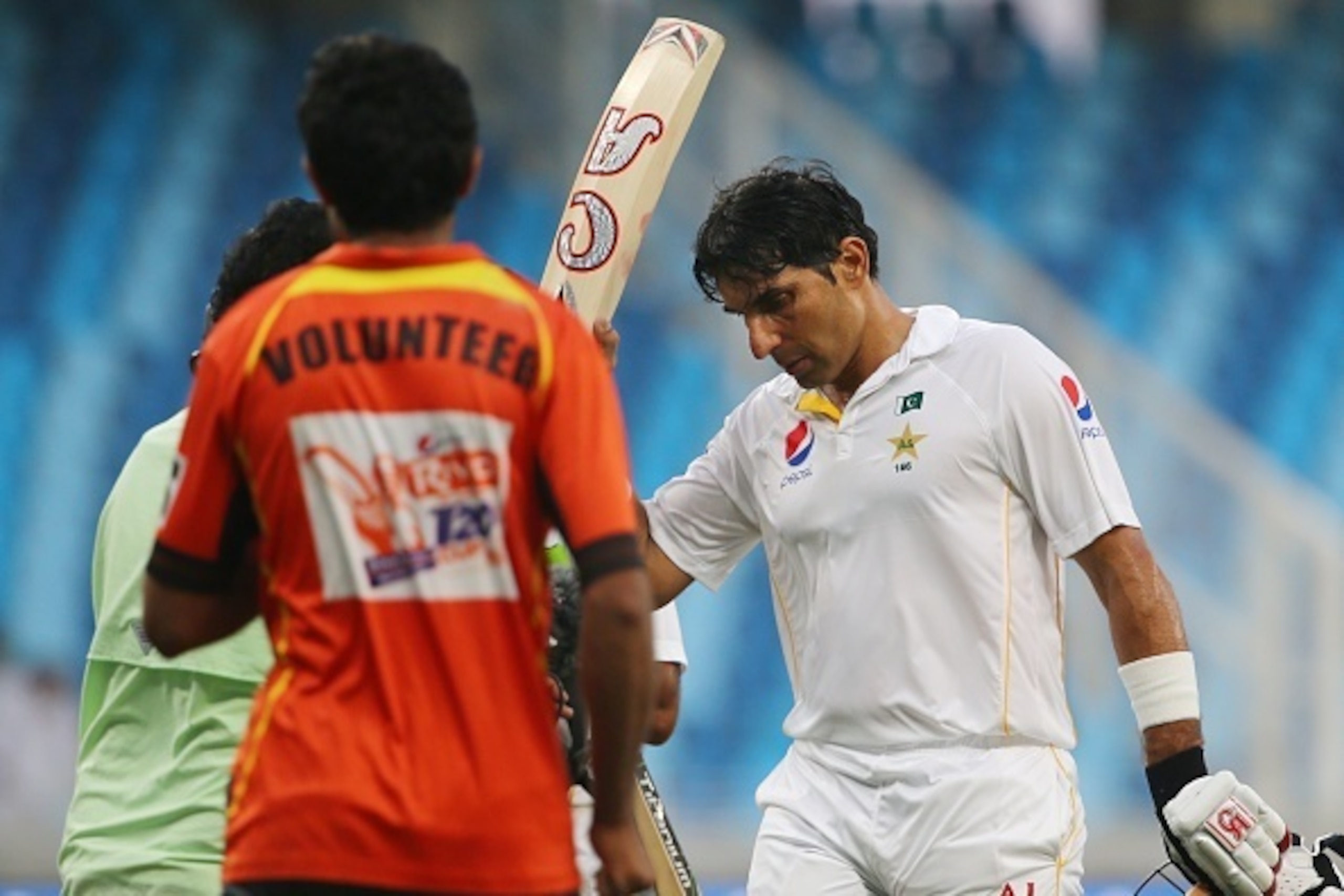 Pakistan's Misbah Ul Haq salutes fans after scoring a century (100 runs) during the first day of the second Test cricket match between Pakistan and England in Dubai on October 22, 2015. AFP PHOTO / MARWAN NAAMANI        (Photo credit should read MARWAN NA