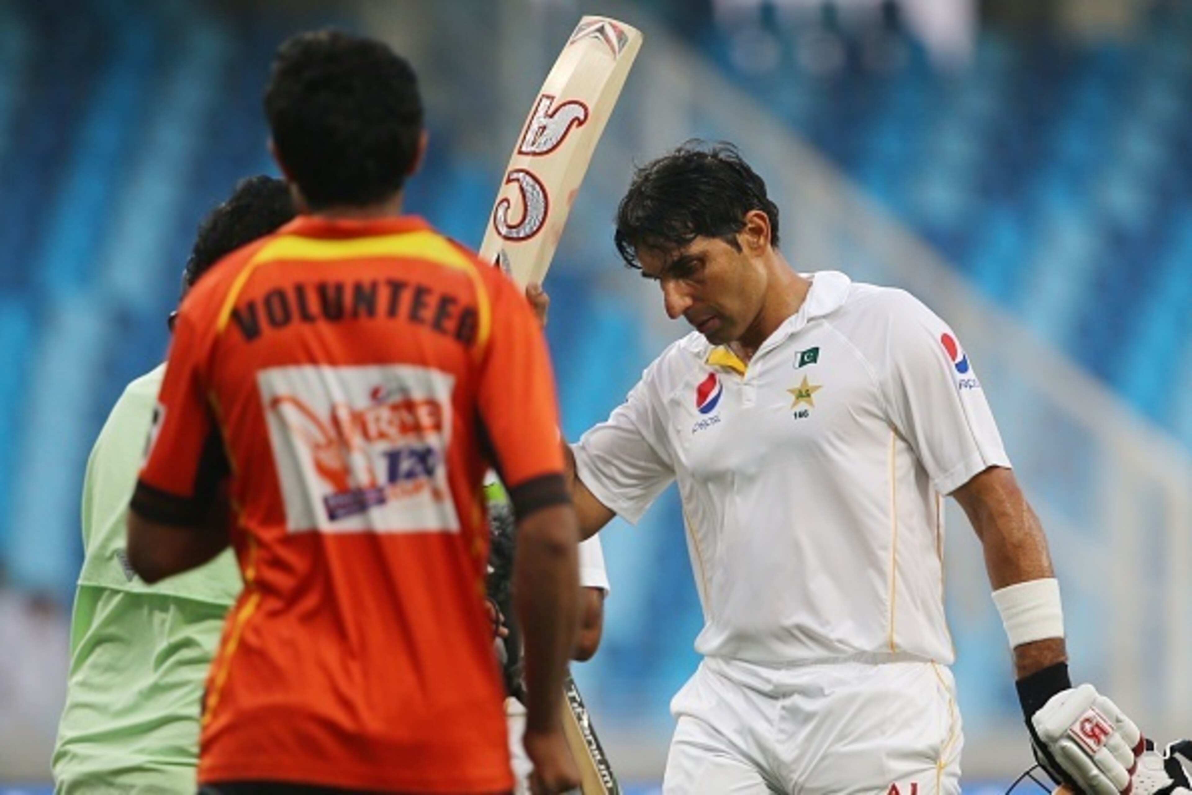 Pakistan's Misbah Ul Haq salutes fans after scoring a century (100 runs) during the first day of the second Test cricket match between Pakistan and England in Dubai on October 22, 2015. AFP PHOTO / MARWAN NAAMANI        (Photo credit should read MARWAN NA