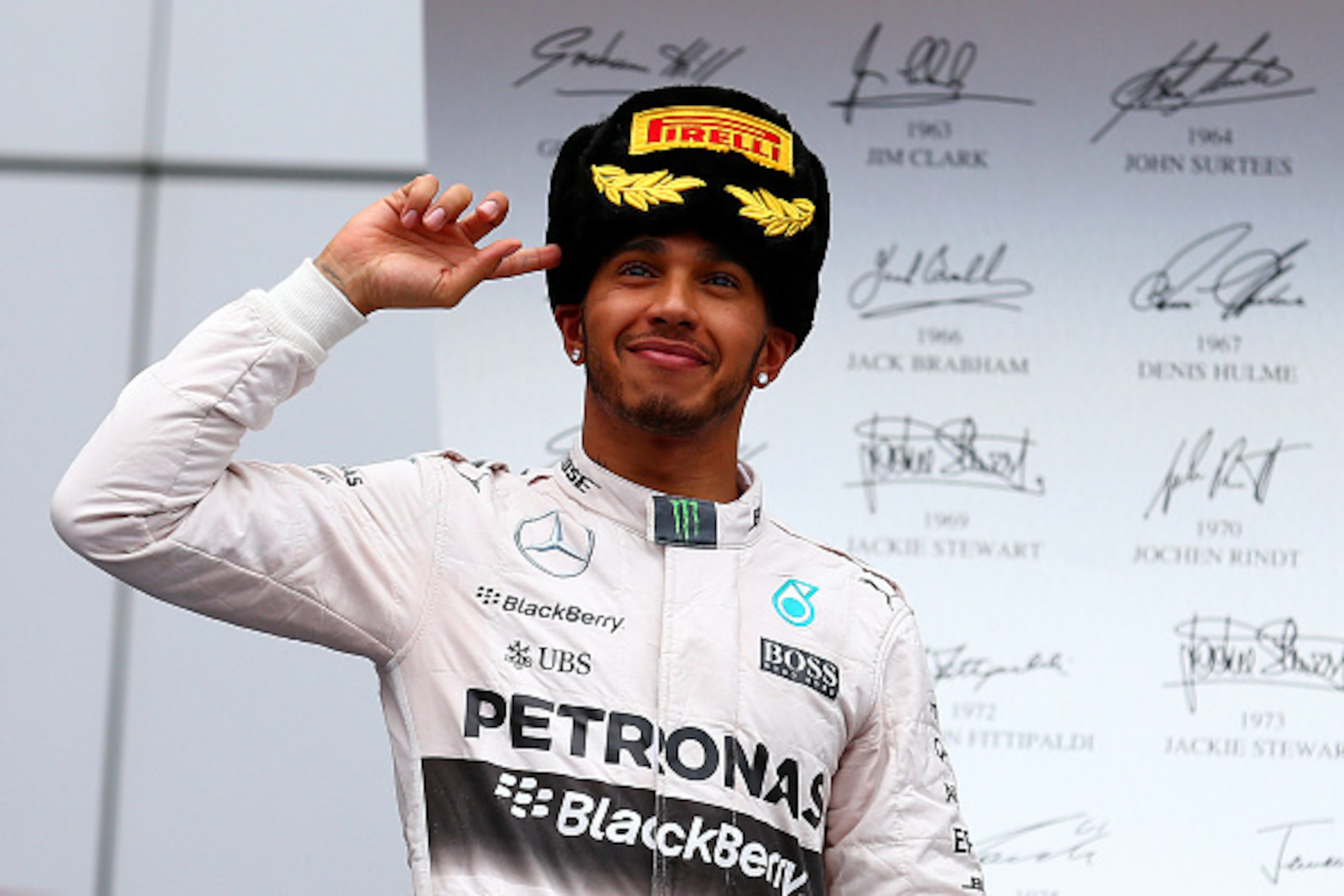 SOCHI, RUSSIA - OCTOBER 11:  Lewis Hamilton of Great Britain and Mercedes GP celebrates on the podium after winning the Formula One Grand Prix of Russia at Sochi Autodrom on October 11, 2015 in Sochi, Russia.  (Photo by Dan Istitene/Getty Images)