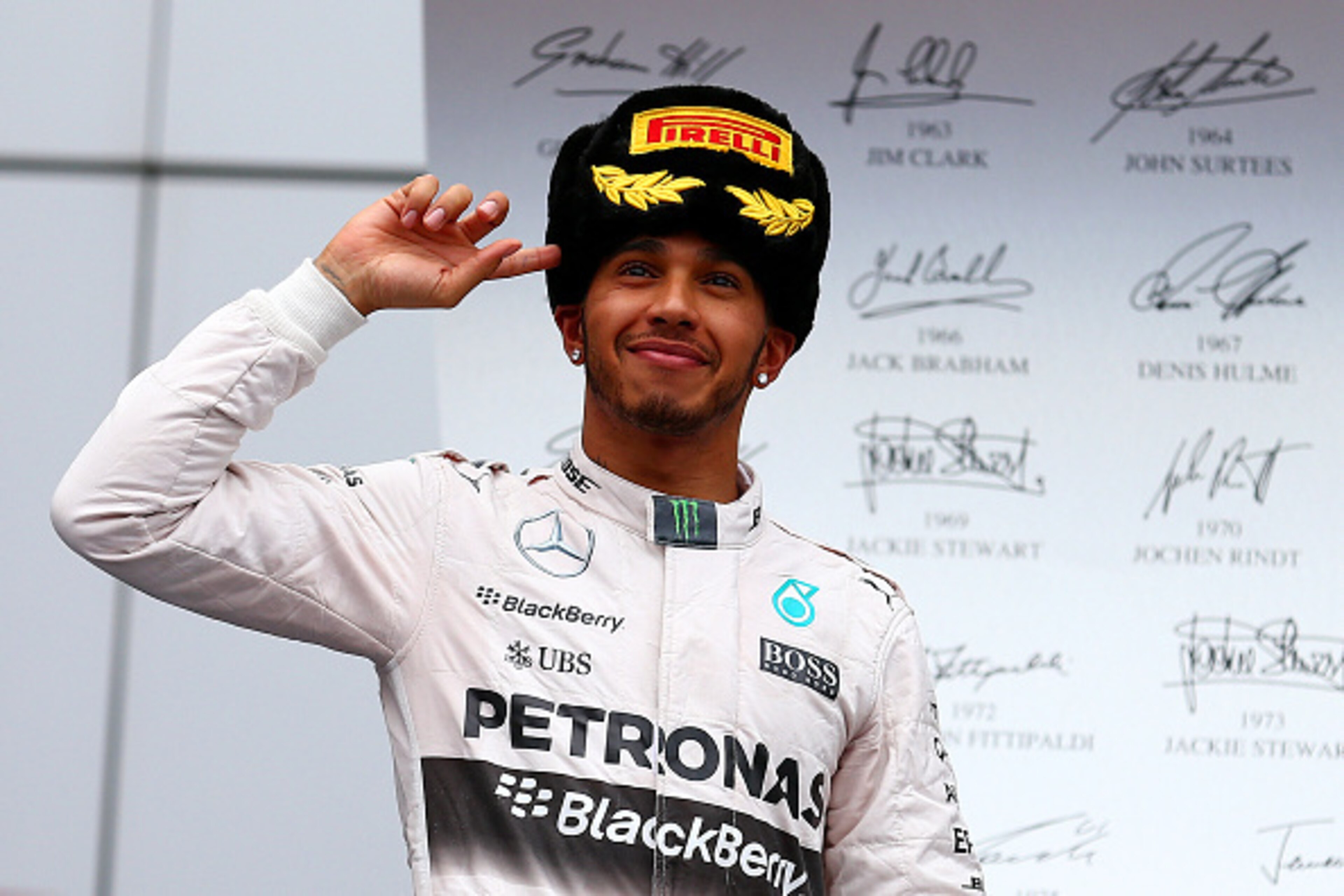 SOCHI, RUSSIA - OCTOBER 11:  Lewis Hamilton of Great Britain and Mercedes GP celebrates on the podium after winning the Formula One Grand Prix of Russia at Sochi Autodrom on October 11, 2015 in Sochi, Russia.  (Photo by Dan Istitene/Getty Images)