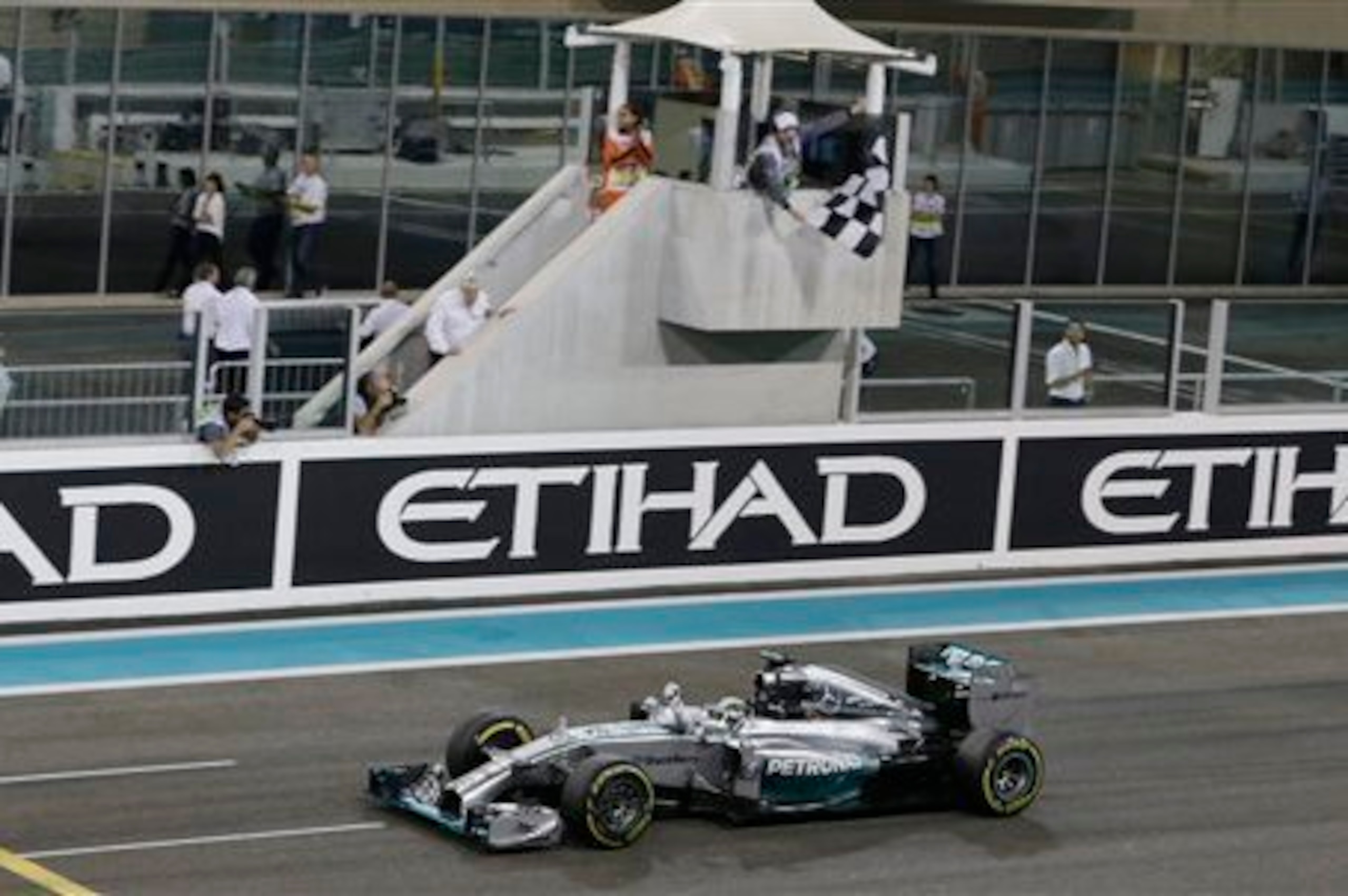 Lewis Hamilton crosses the line at last season's Abu Dhabi Grand Prix to become a double world champion.