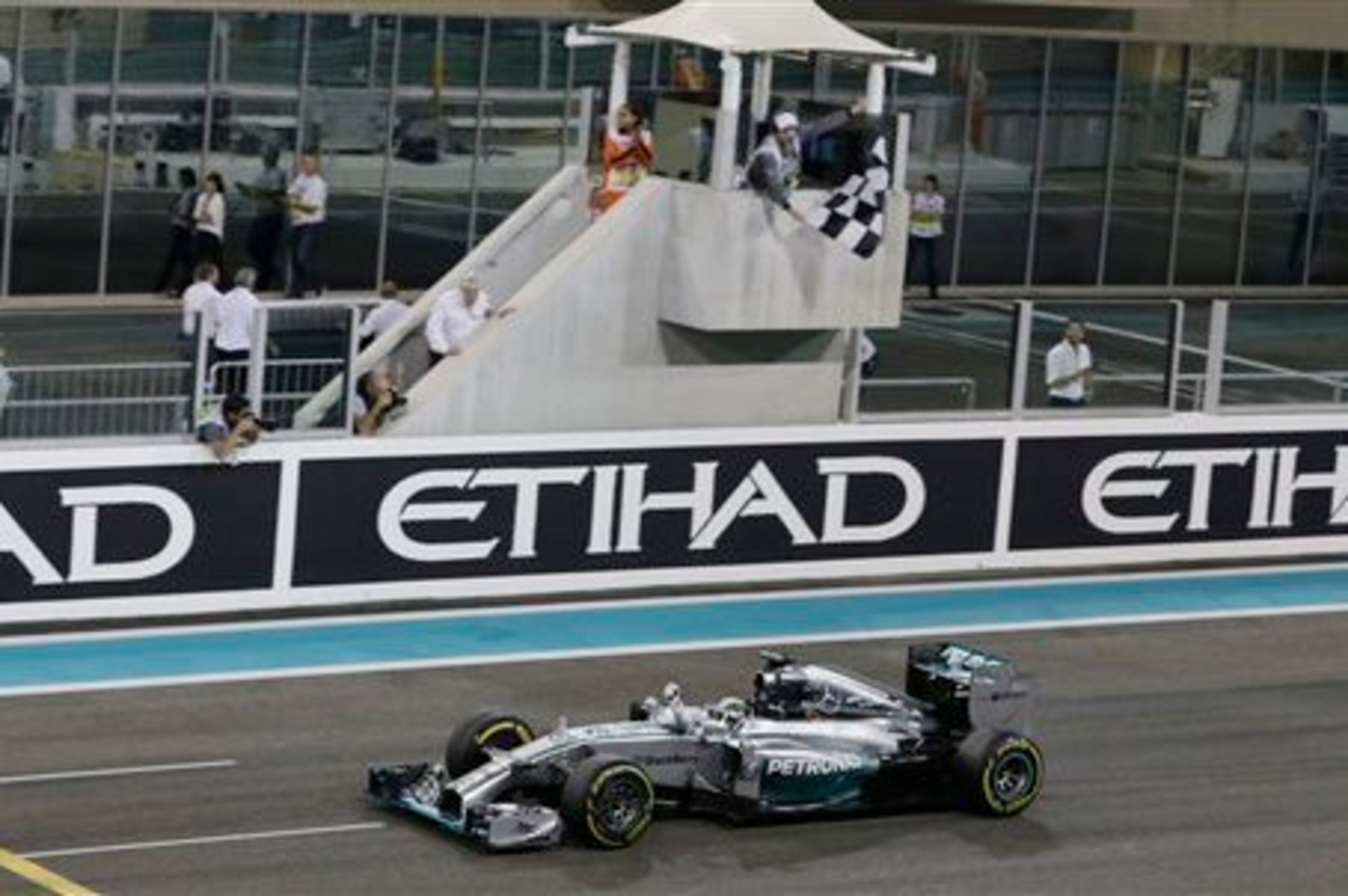 Lewis Hamilton crosses the line at last season's Abu Dhabi Grand Prix to become a double world champion.