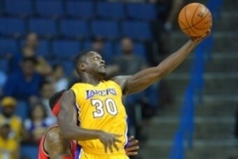 Oct 8, 2015; Ontario, CA, USA; Toronto Raptors forward James Johnson (3) guards Los Angeles Lakers forward Julius Randle (30) during the second quarter of the game at Citizens Business Bank Arena. Mandatory Credit: Jayne Kamin-Oncea-USA TODAY Sports