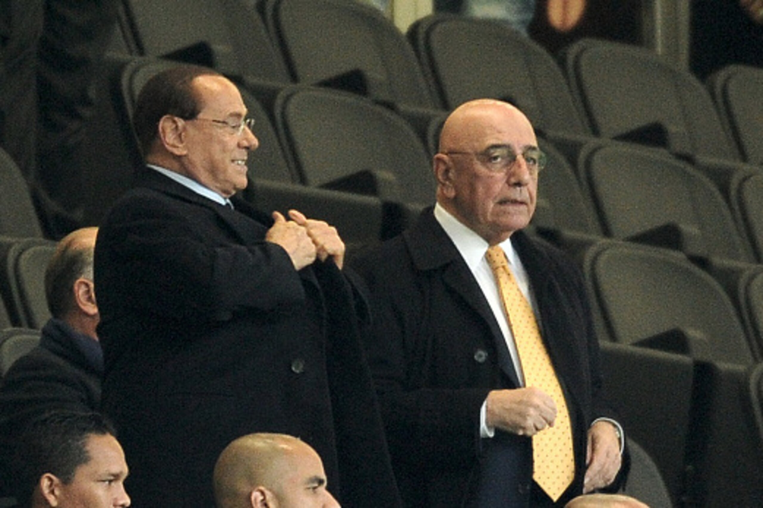 MILAN, ITALY - OCTOBER 21:  (L-R) President of AC Milan Silvio Berlusconi and Adriano Galliani atend the Berlusconi Trophy match between AC Milan and FC Internazionale at Stadio Giuseppe Meazza on October 21, 2015 in Milan, Italy.  (Photo by Pier Marco Ta