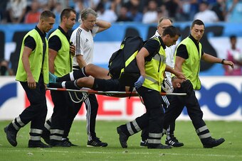 MARSEILLE, FRANCE - AUGUST 01:  Sami Khedira of Juventus FC is helped from the pitch after sustaining an injury during the preseason friendly match between Olympique de Marseille and Juventus FC at Stade Velodrome on August 1, 2015 in Marseille, France.  