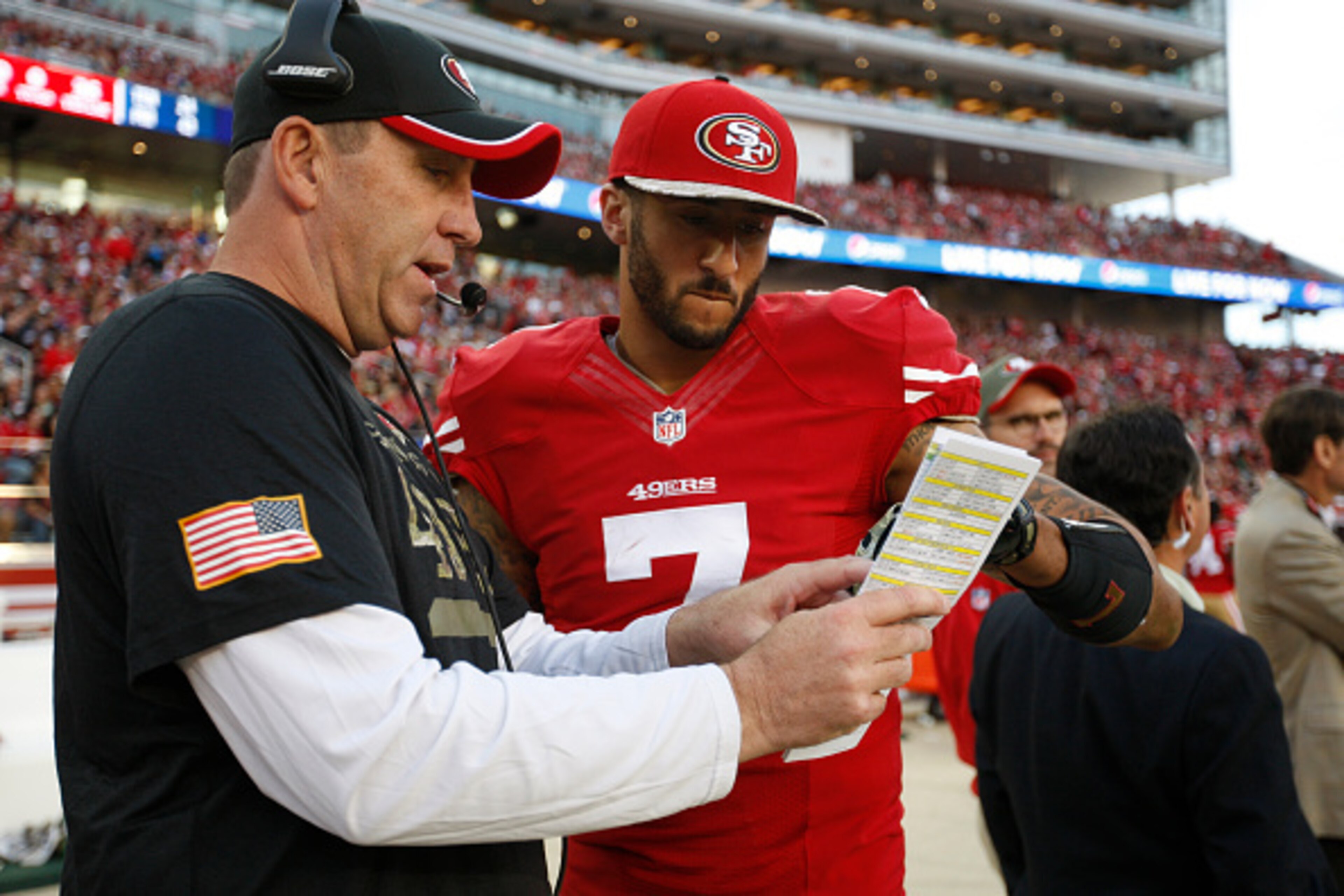 SANTA CLARA, CA - NOVEMBER 23: Quarterbacks Coach Geep Chryst of the San Francisco 49ers talks with Colin Kaepernick #7 during the game against the Washington Redskins at Levi Stadium on November 23, 2014 in Santa Clara, California. The 49ers defeated the