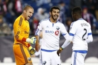 Oct 17, 2015; Foxborough, MA, USA; Montreal Impact goalkeeper Evan Bush (1) and defender Victor Cabrera (36) and defender Ambroise Oyongo (2) celebrate a victory against the New England Revolution at Gillette Stadium. Mandatory Credit: Mark L. Baer-USA TO