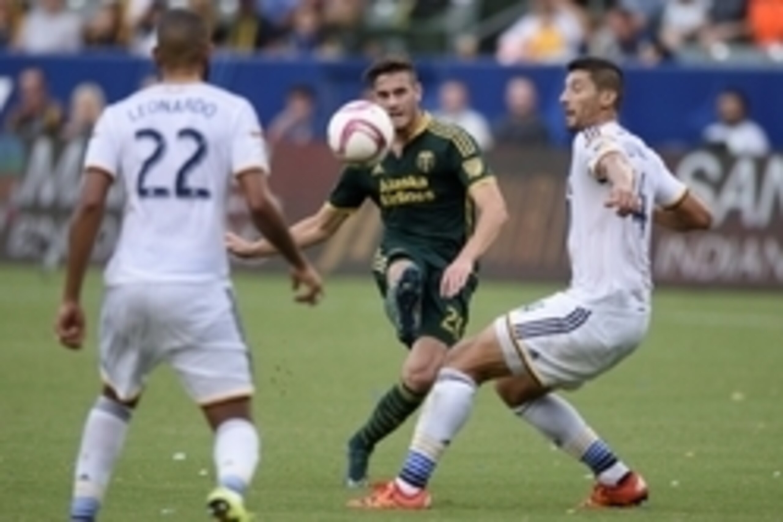 Oct 18, 2015; Carson, CA, USA; Portland Timbers forward Lucas Melano (center) attempts a shots defended by Los Angeles Galaxy defender Omar Gonzalez (right) during the first half at StubHub Center. Mandatory Credit: Kelvin Kuo-USA TODAY Sports