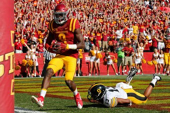 AMES, IA - SEPTEMBER 12: Wide receiver Quenton Bundrage #9 of the Iowa State Cyclones scores a touchdown as defensive back Greg Mabin #13 of the Iowa Hawkeyes defends in the first half of play at Jack Trice Stadium on September 12, 2015 in Ames, Iowa. (Ph