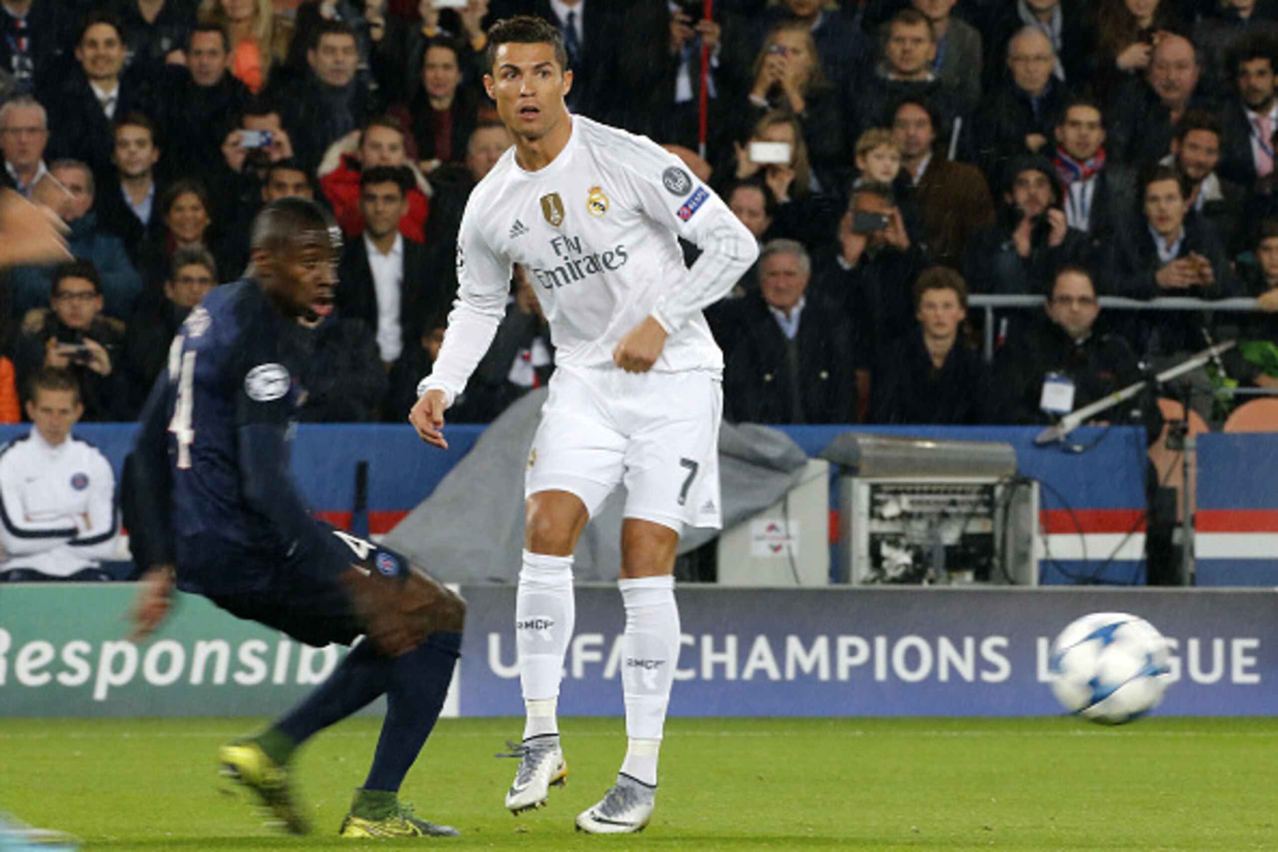 PARIS, FRANCE - OCTOBER 21: Cristiano Ronaldo of Real Madrid and Serge Aurier of PSG (left) in action during the UEFA Champions League match between Paris Saint-Germain (PSG) and Real Madrid at Parc des Princes stadium on October 21, 2015 in Paris, France