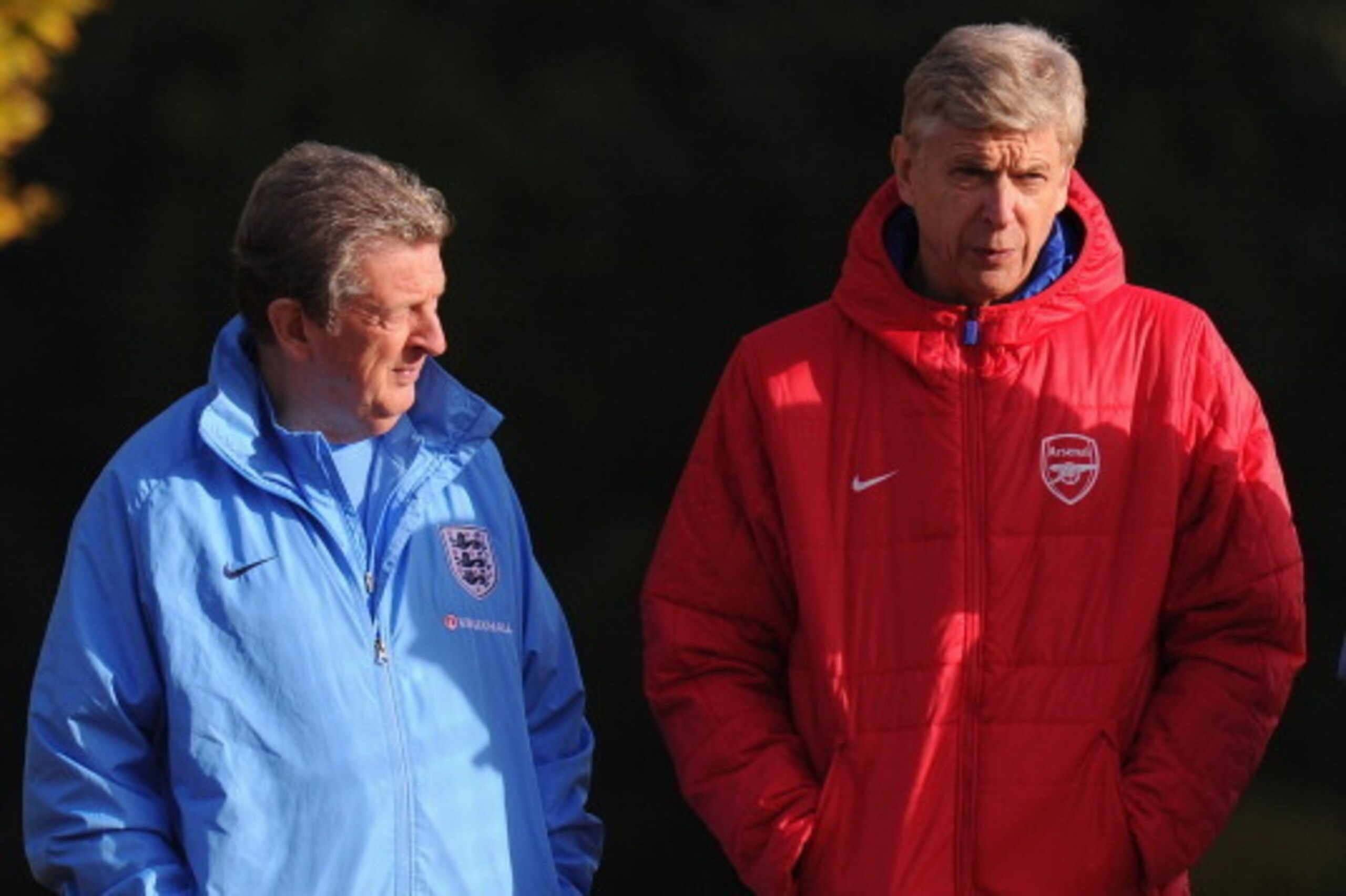 ST ALBANS, ENGLAND - NOVEMBER 13:  England manager Roy Hodgson chats with Arsenal manager Arsene Wenger during an England Training Session at London Colney on November 13, 2013 in St Albans, England.  (Photo by Mike Hewitt/Getty Images)