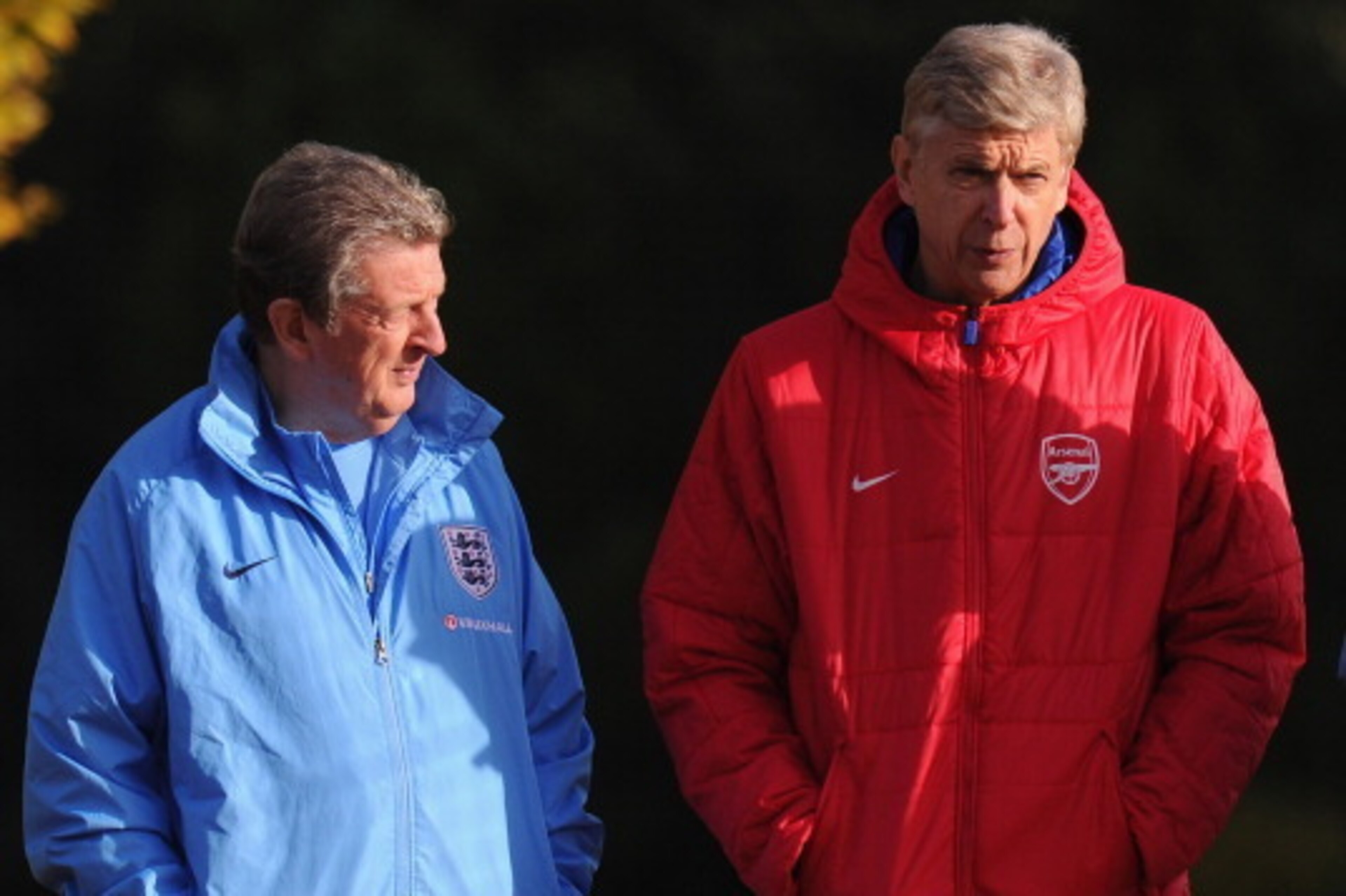 ST ALBANS, ENGLAND - NOVEMBER 13:  England manager Roy Hodgson chats with Arsenal manager Arsene Wenger during an England Training Session at London Colney on November 13, 2013 in St Albans, England.  (Photo by Mike Hewitt/Getty Images)