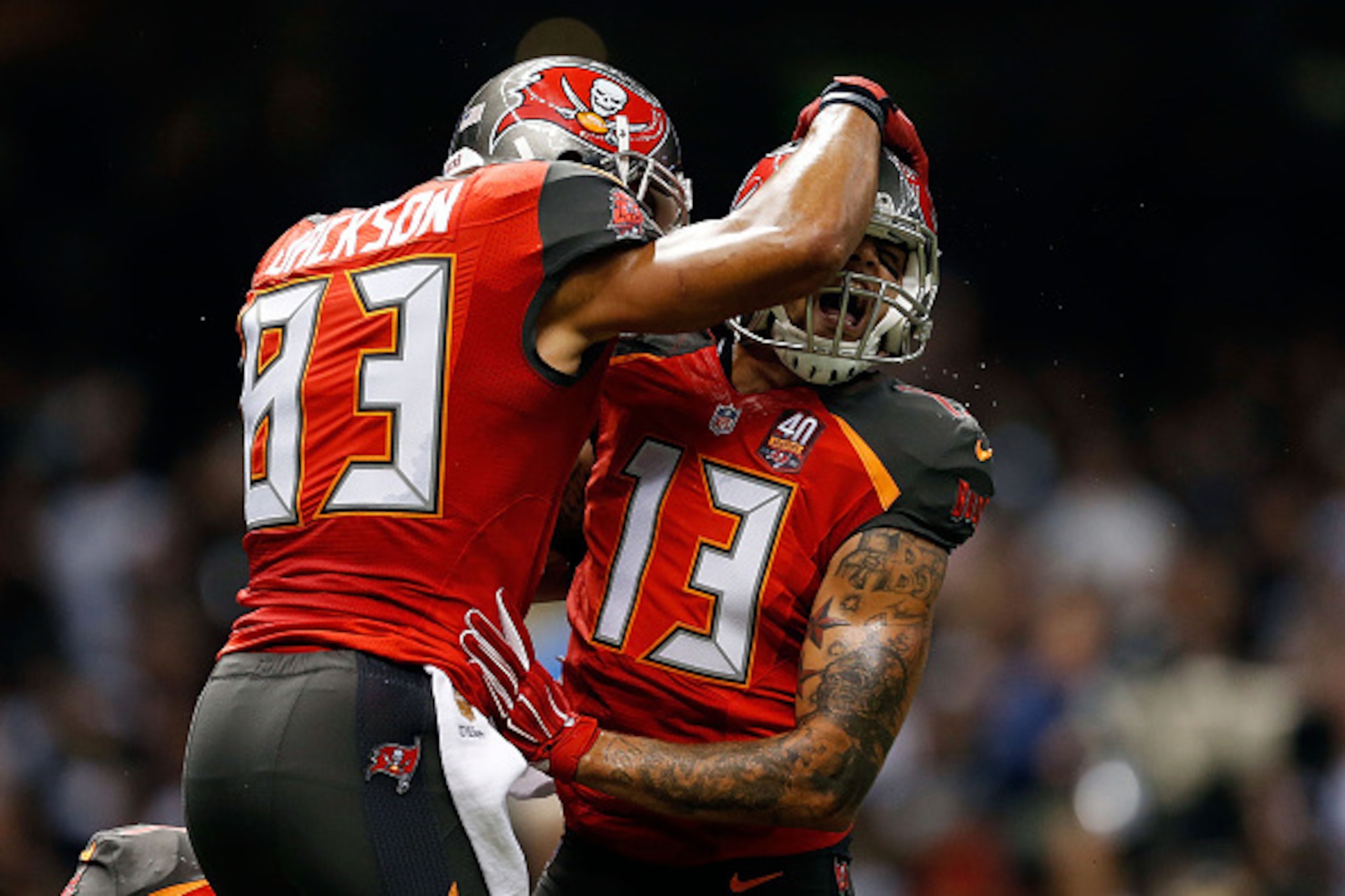 NEW ORLEANS, LA - SEPTEMBER 20:  Mike Evans #13 celebrates with Vincent Jackson #83 of the Tampa Bay Buccaneers following his touchdown reception during the second quarter of a game against the New Orleans Saints at the Mercedes-Benz Superdome on Septembe