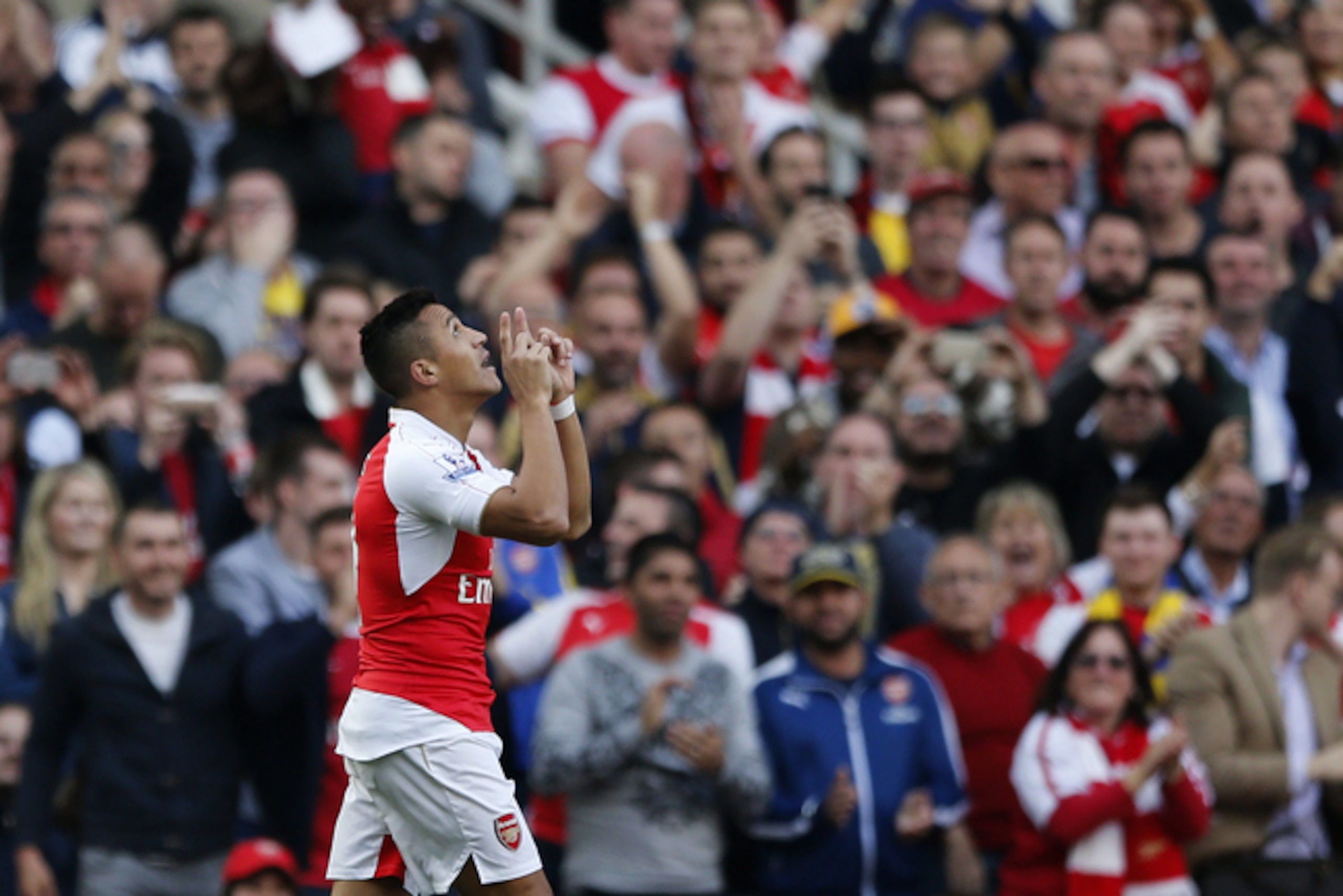 Alexis Sanchez celebrates scoring against United.