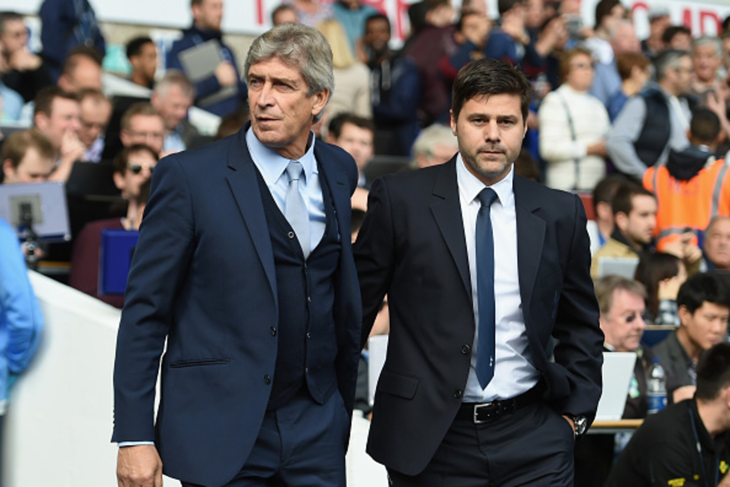 LONDON, ENGLAND - SEPTEMBER 26:  Manuel Pellegrini, manager of Manchester City and Mauricio Pochettino Manager of Tottenham Hotspur greet prior to the Barclays Premier League match between Tottenham Hotspur and Manchester City at White Hart Lane on Septem