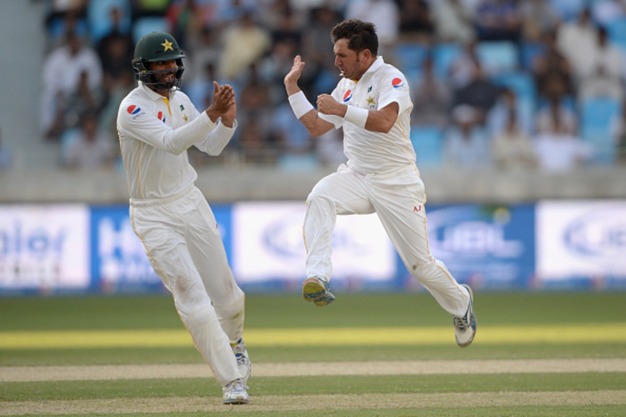 DUBAI, UNITED ARAB EMIRATES - OCTOBER 23:  Yasir Shah of Pakistan celebrates dismissing England captain Alastair Cook during day two of the 2nd test match between Pakistan and England at Dubai Cricket Stadium on October 23, 2015 in Dubai, United Arab Emir