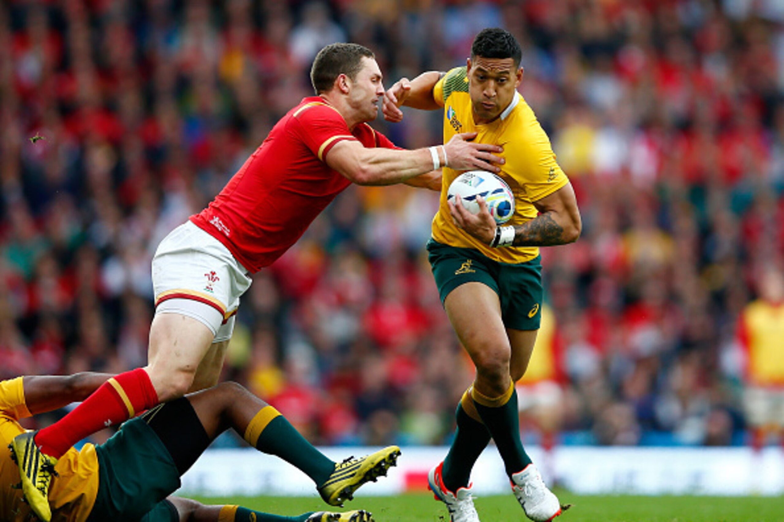 LONDON, ENGLAND - OCTOBER 10: Israel Folau of Australia is tackled by George North of Wales during the 2015 Rugby World Cup Pool A match between Australia and Wales at Twickenham Stadium on October 10, 2015 in London, United Kingdom. (Photo by Shaun Bott LONDON, ENGLAND - OCTOBER 10: Israel Folau of Australia is tackled by George North of Wales during the 2015 Rugby World Cup Pool A match between Australia and Wales at Twickenham Stadium on October 10, 2015 in London, United Kingdom. (Photo by Shaun Bott